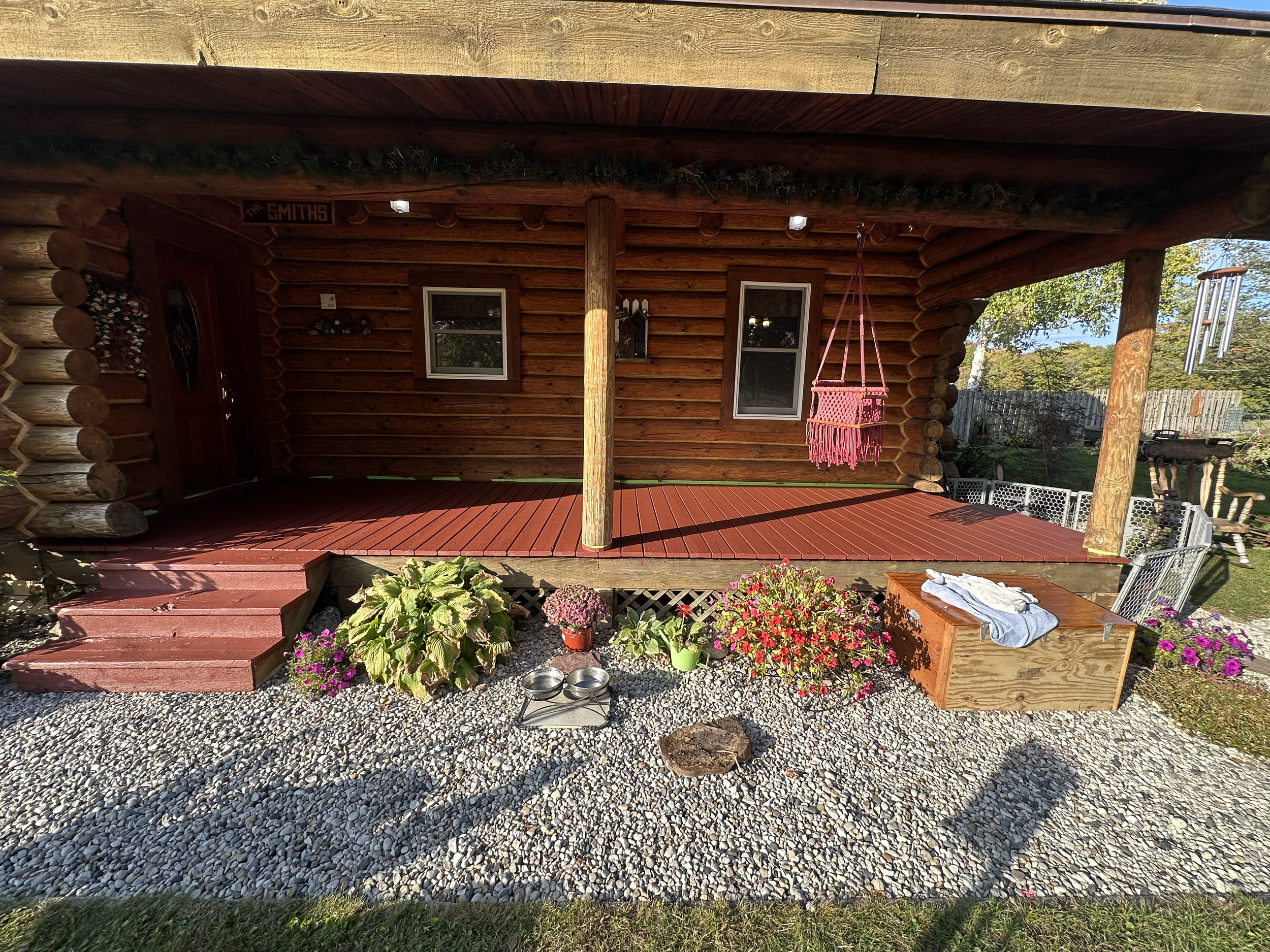 Porch Refinish
Complete deck and stair refinishing to restore the warmth of this log cabin. The redwood stain brings out the natural tones of the wood, with fresh trim and gravel edging for a clean, finished look.