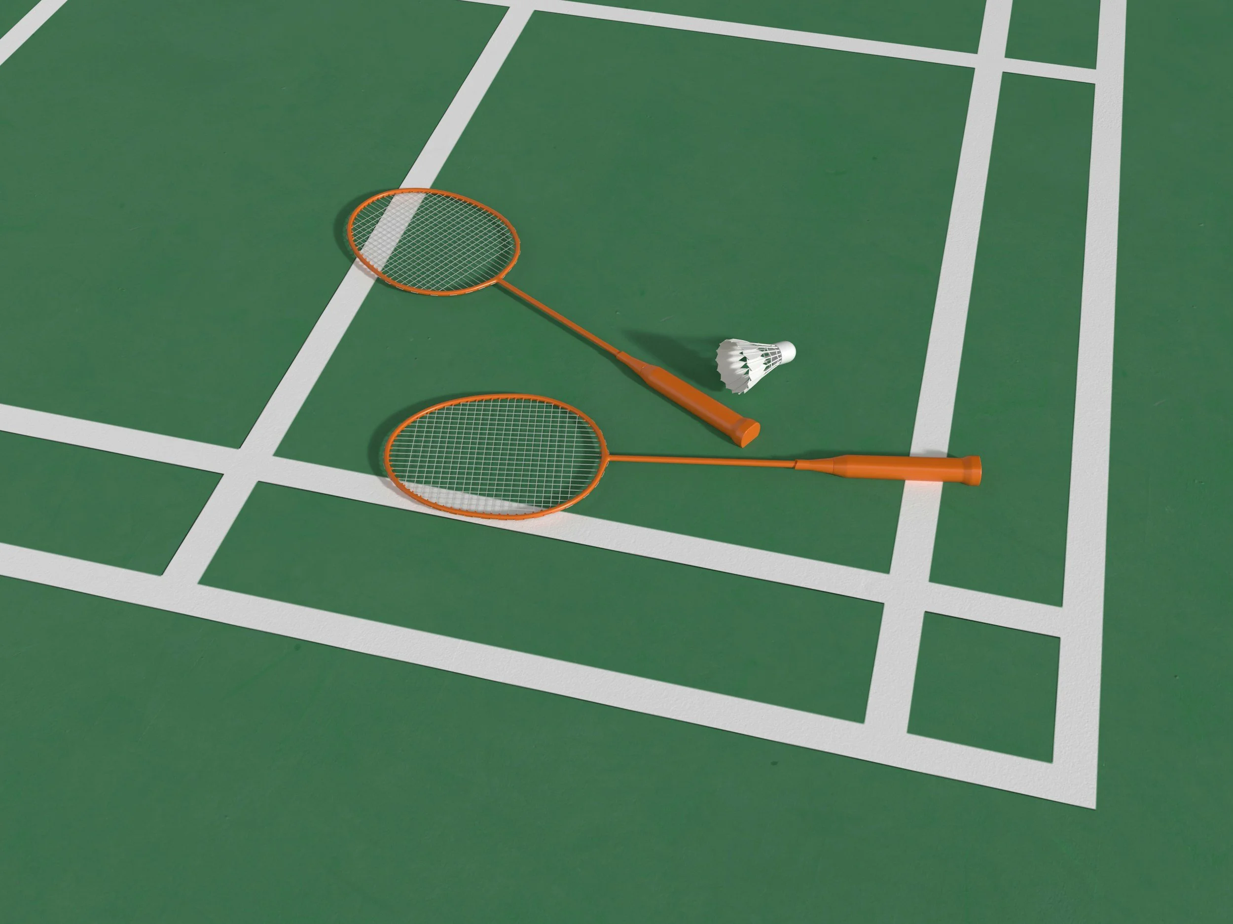 Two orange badminton rackets and a shuttlecock resting on a green court with white lines.