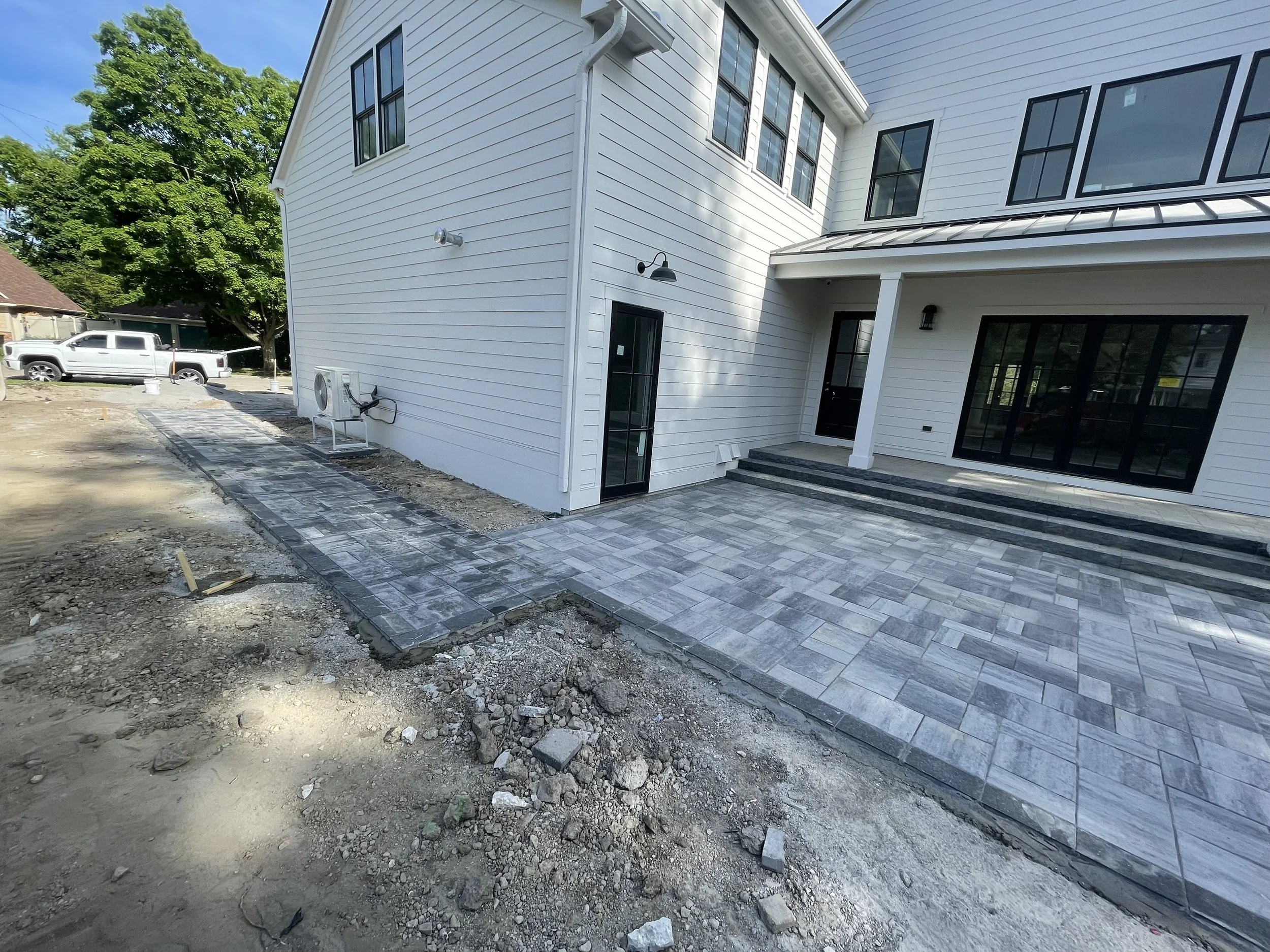 Back yard paver patio with walkway