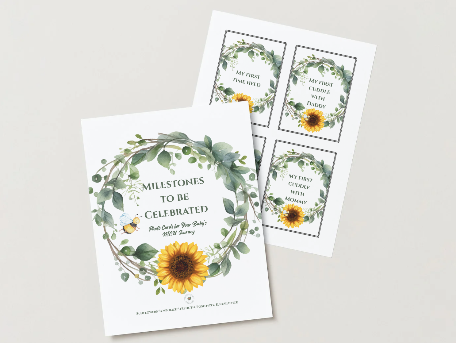Set of milestone celebration cards for a baby's NICU journey, featuring a sunflower and greenery wreath, with four smaller cards for first milestones with parents and daddy.