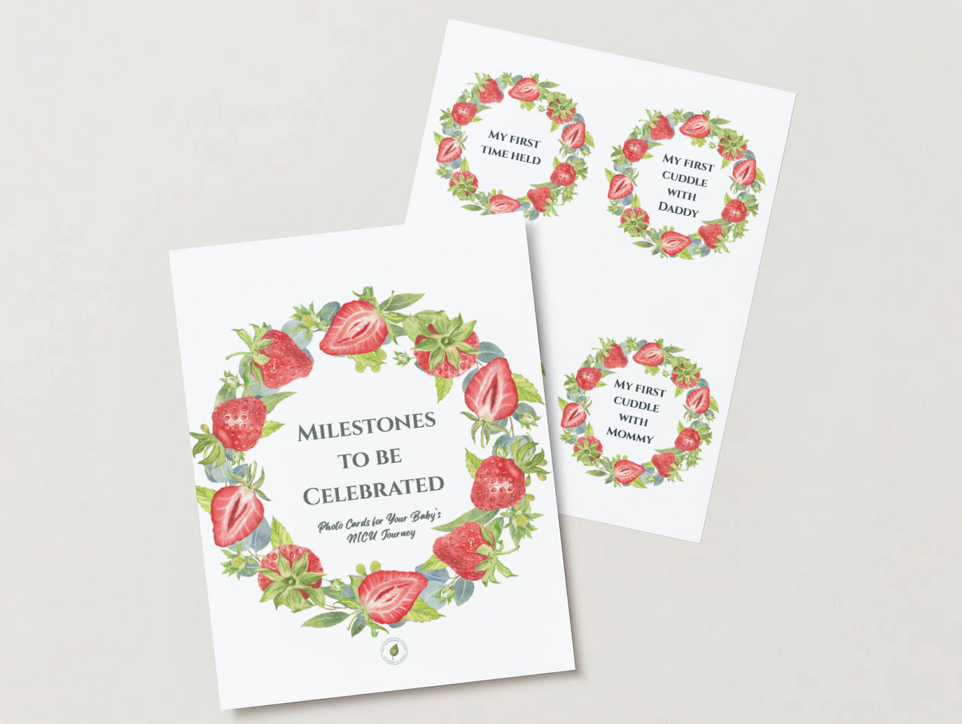 Set of milestone celebration cards with strawberry and berry floral designs, including titles such as "Milestones to be Celebrated" and prompts for baby milestones like first time held, cuddle with daddy, and cuddle with mommy.
