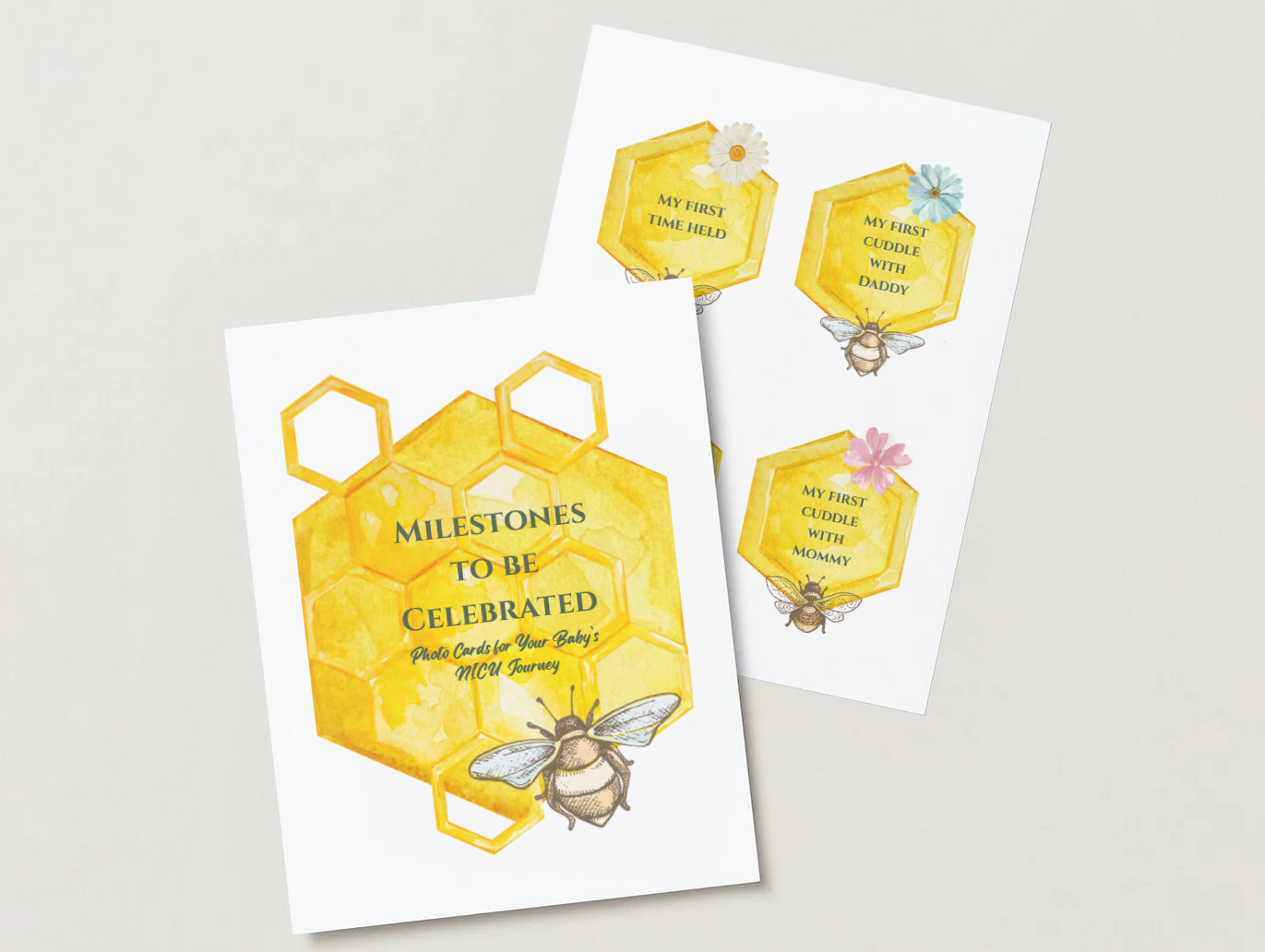 Two sets of baby milestone photo cards with a honeycomb and bee theme, featuring text about first cuddles with daddy, mommy, and first time held.