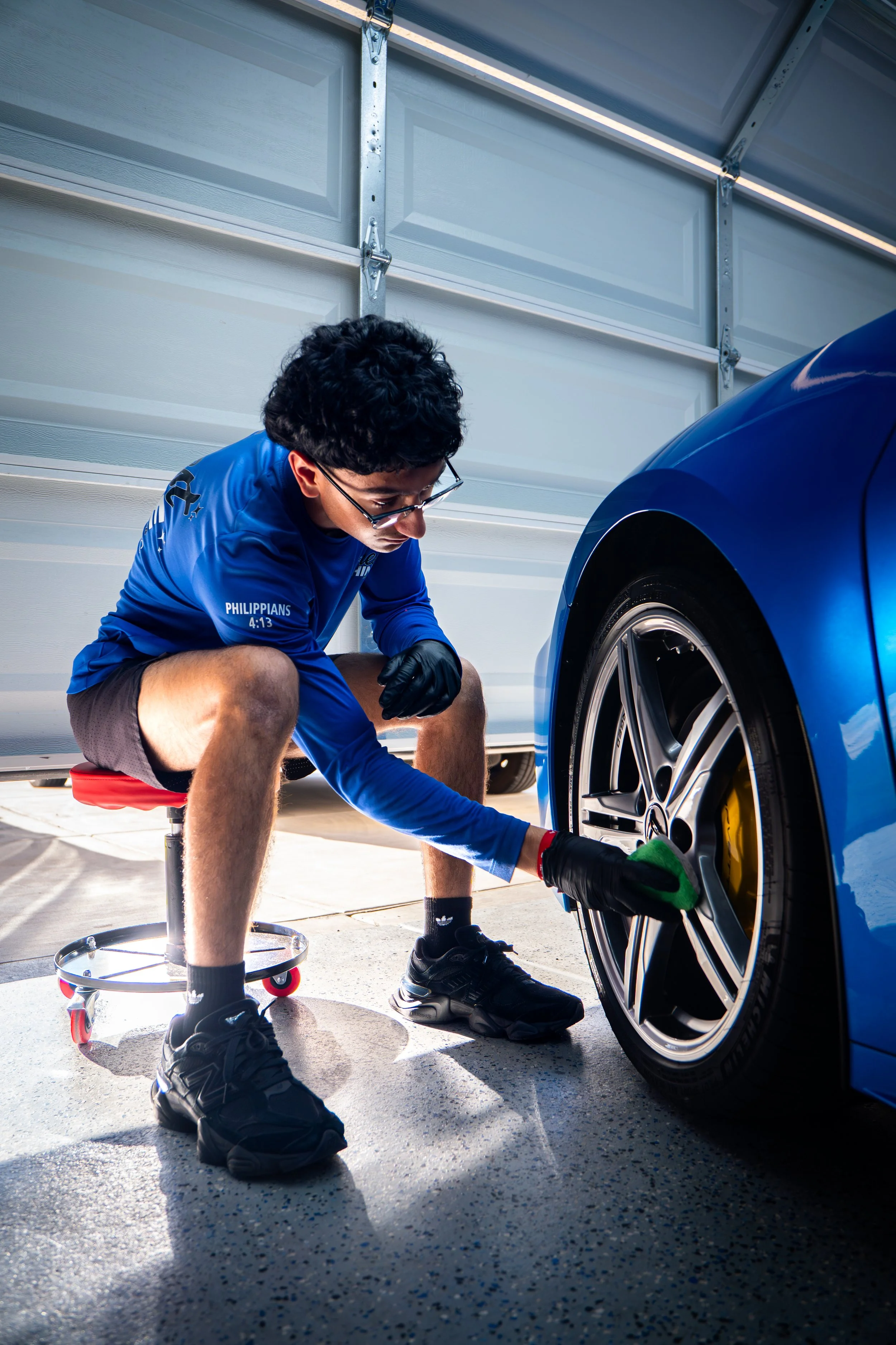 A person ceramic coating wheels