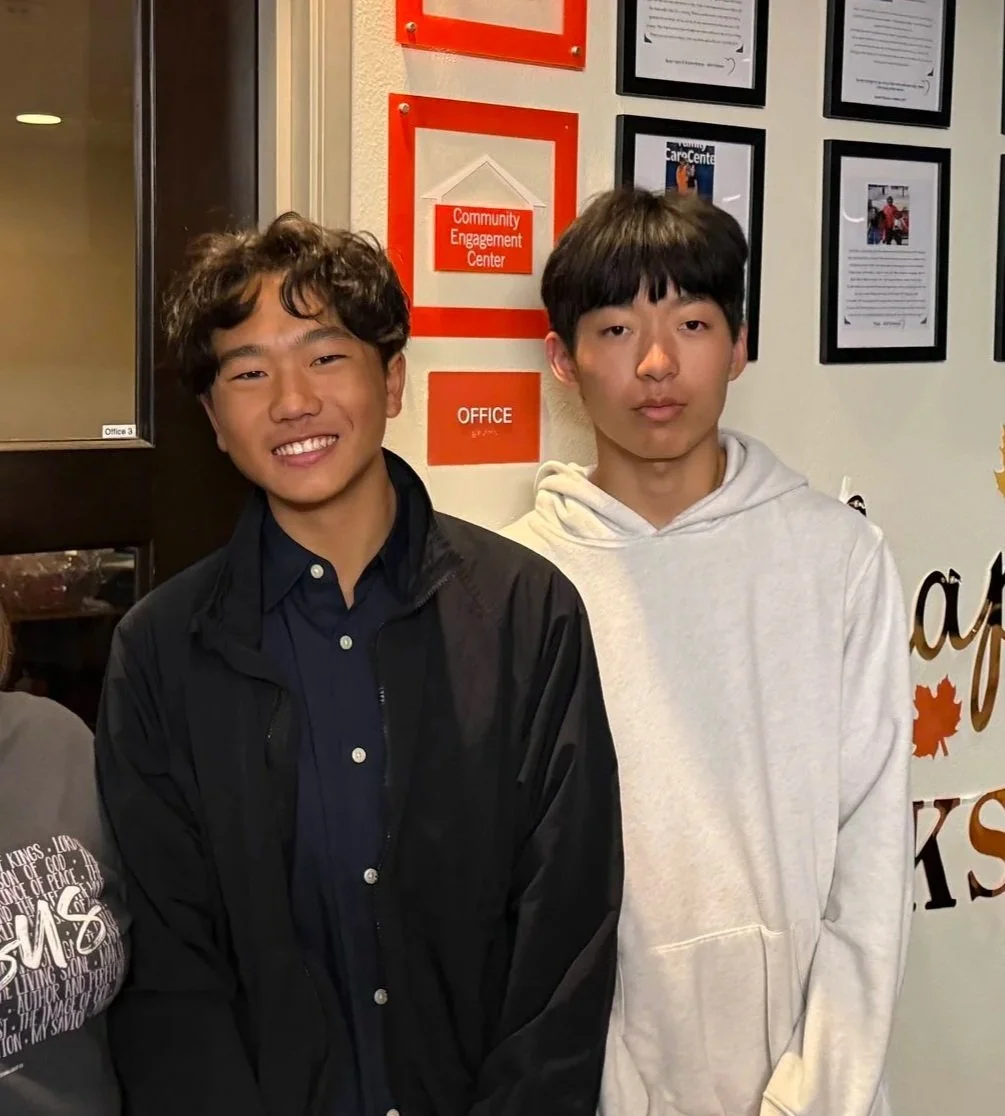 Empowered Smiles Initiative volunteers packing toothbrushes into dental hygiene kits