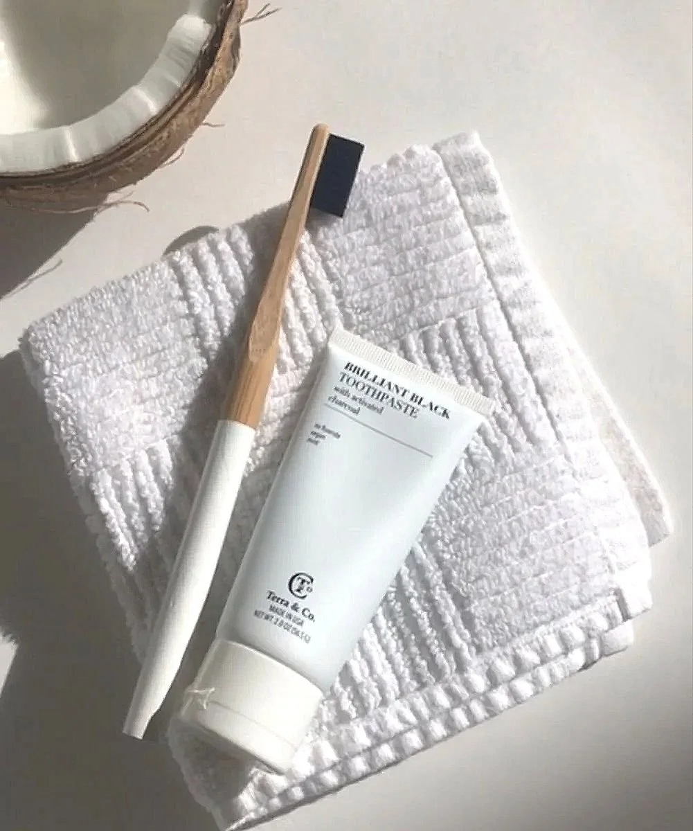 Empowered Smiles Initiative dental hygiene kit with toothbrush, toothpaste, and floss