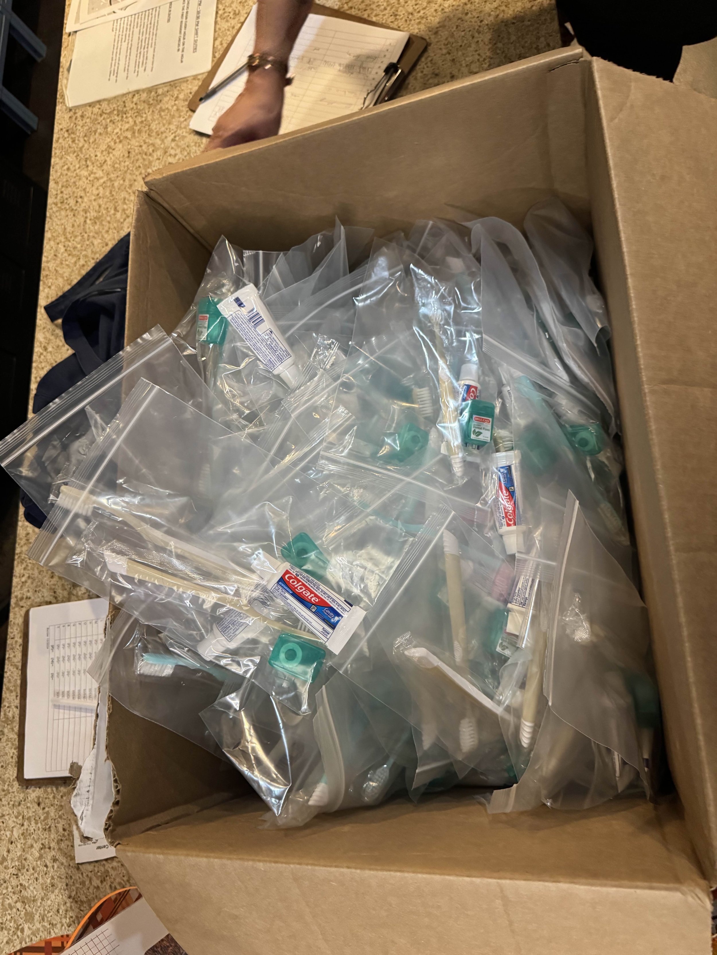 The supplies included in a free Empowered Smiles Initiative dental hygiene kit. Donated to homeless shelter