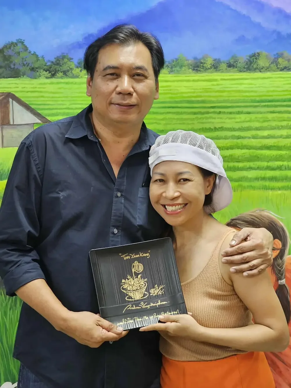 Owner Pang cooking for Chef Prachan (food stylist and celebrity chef) in Bangkok.