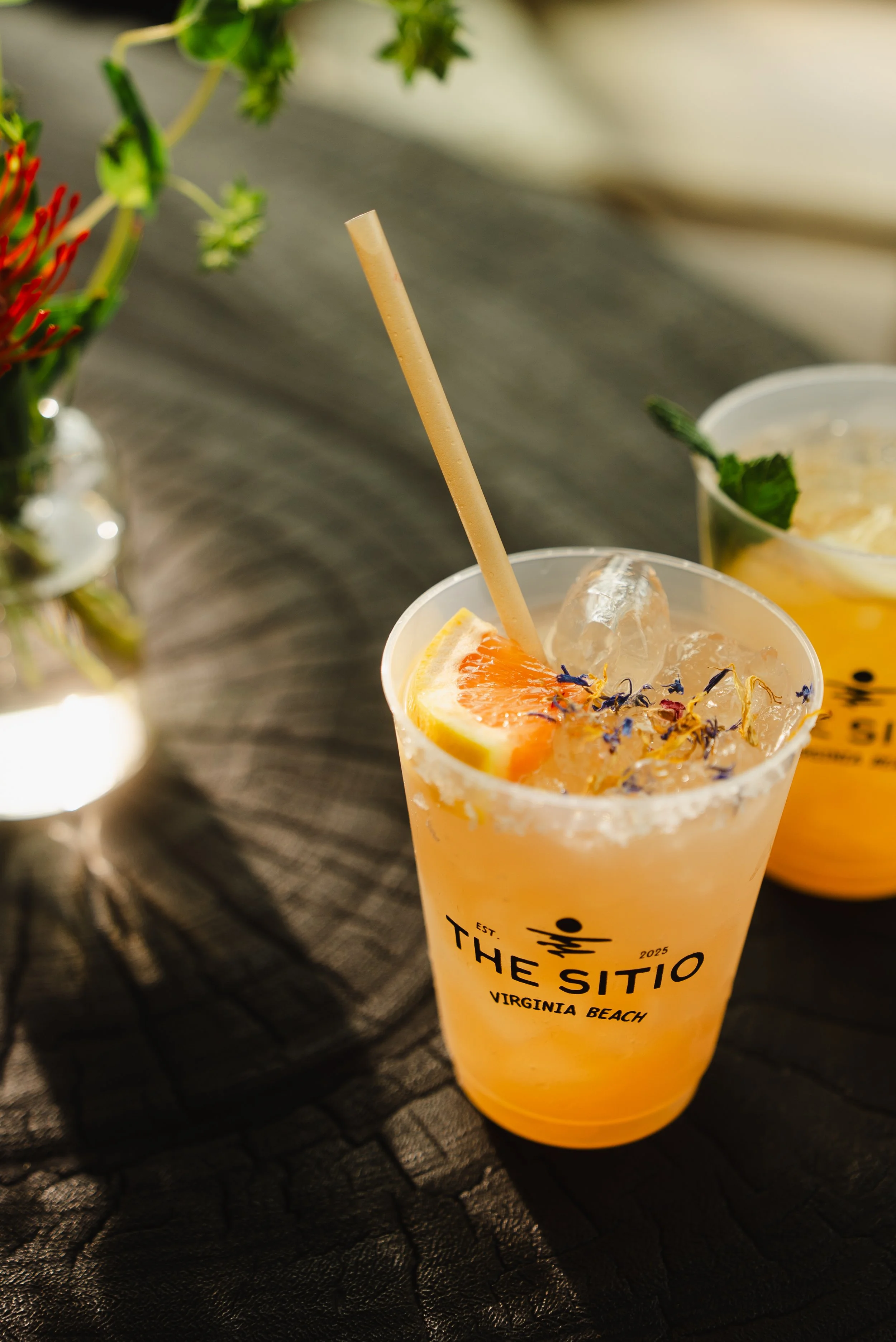Cocktail cup with The Sitio logo at Atlantic Park Virginia Beach hotel