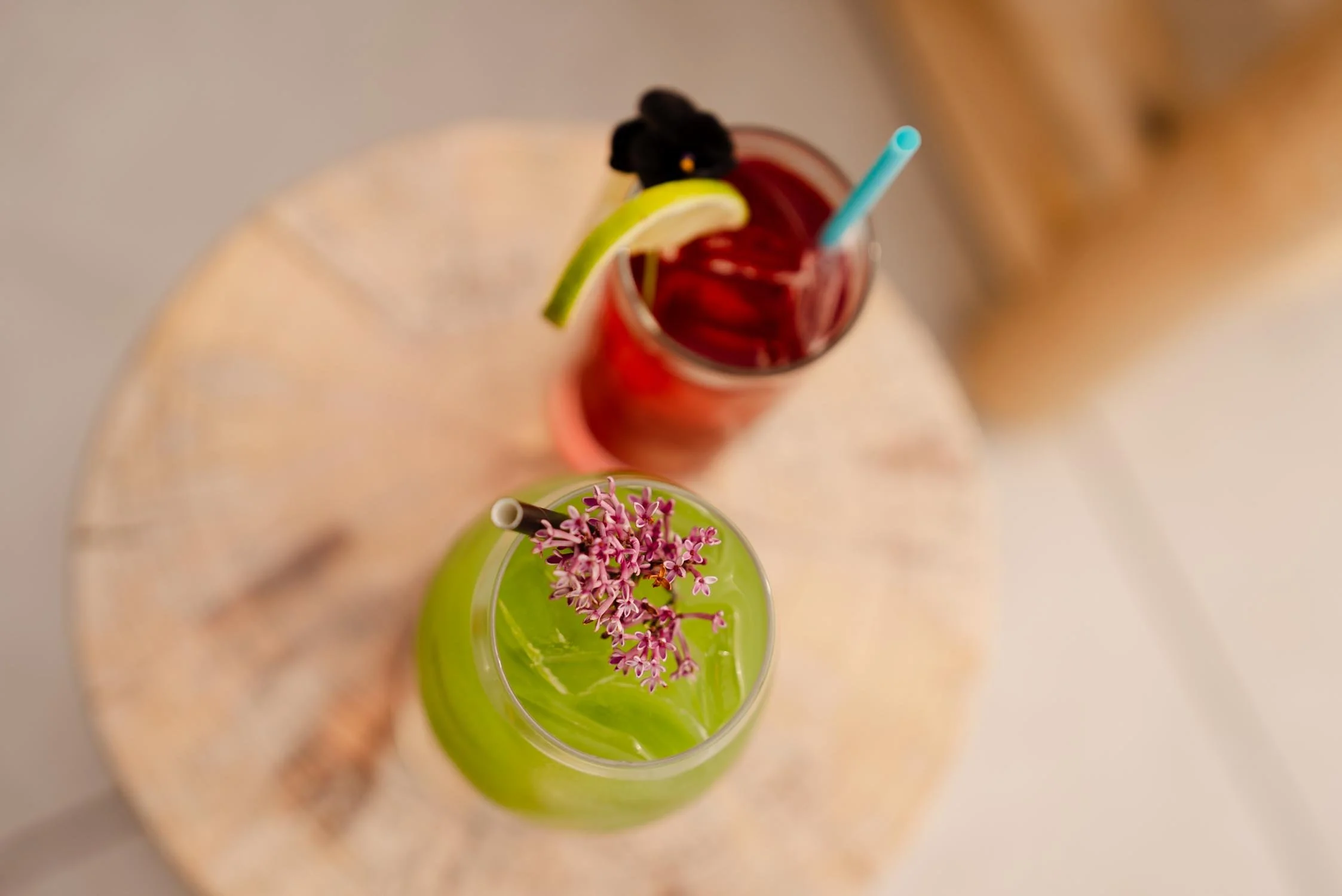 Two colorful cocktails on a table at The Sunroom at The Sitio Atlantic Park