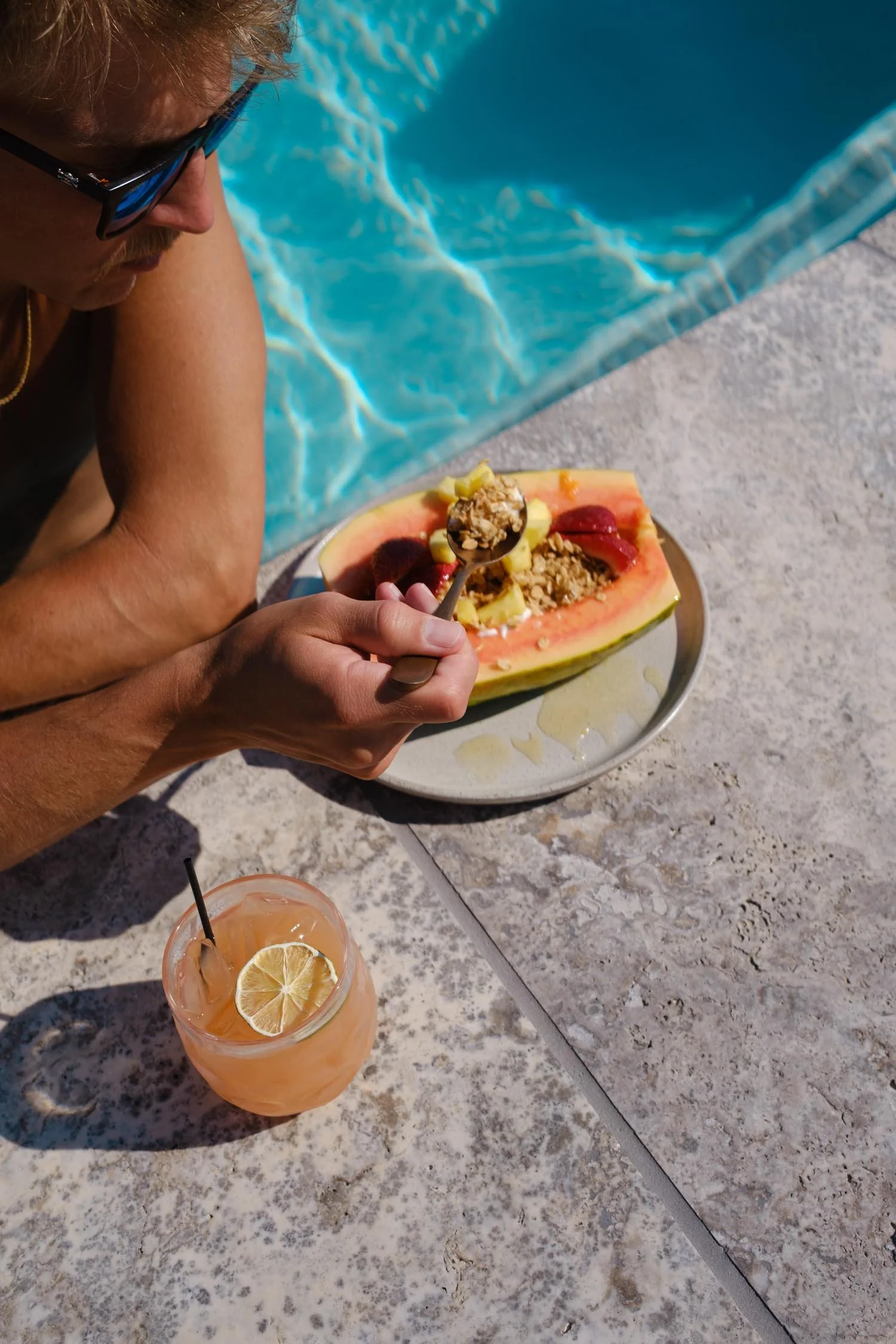 Cocktail and papaya parfait with granola by the pool at The Sitio, a Virginia Beach hotel near Atlantic Park Surf