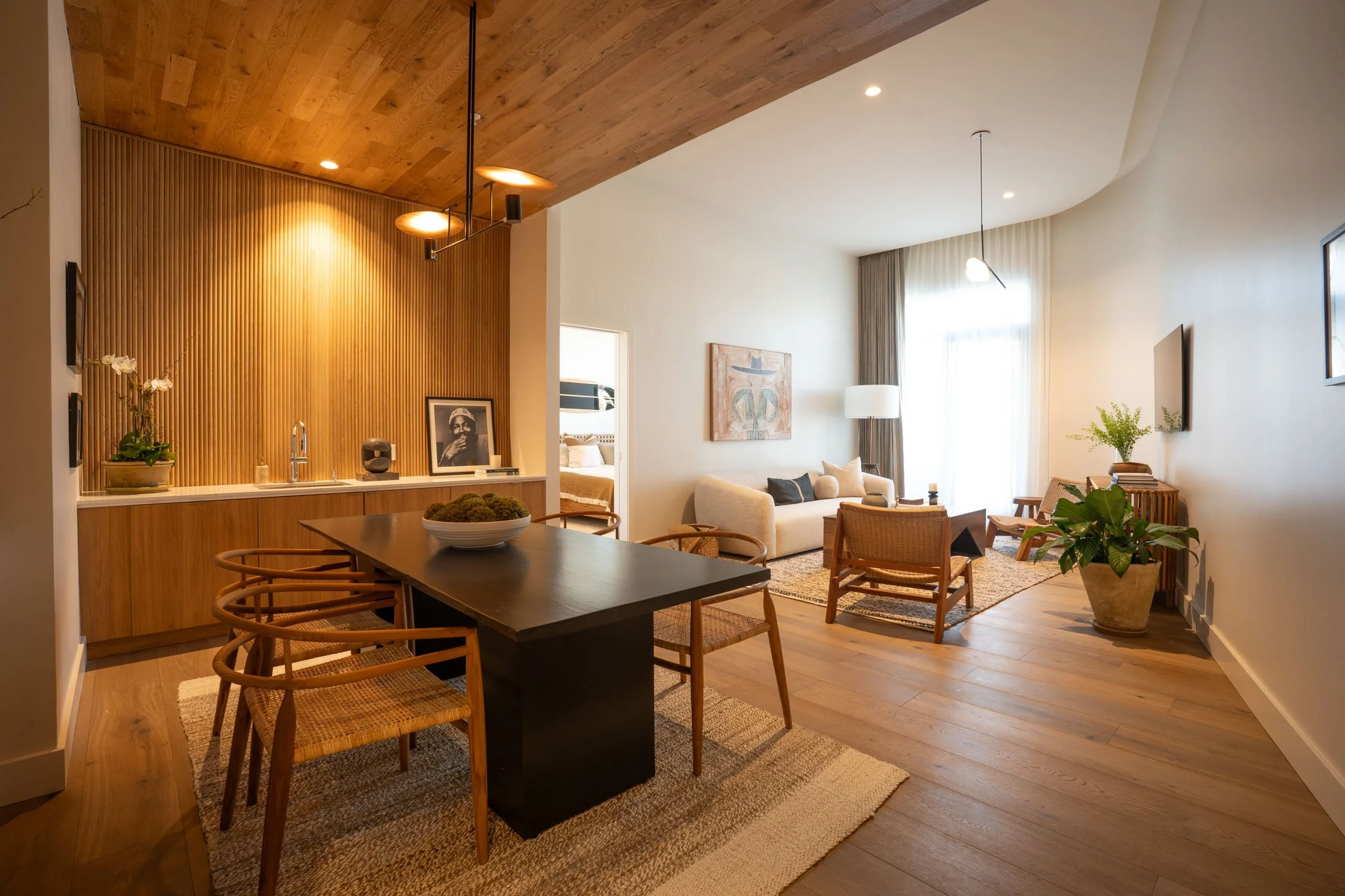 Cove Suite at Atlantic Park boutique hotel overlooking the surf lagoon with custom surfboard rack and coastal wood paneling