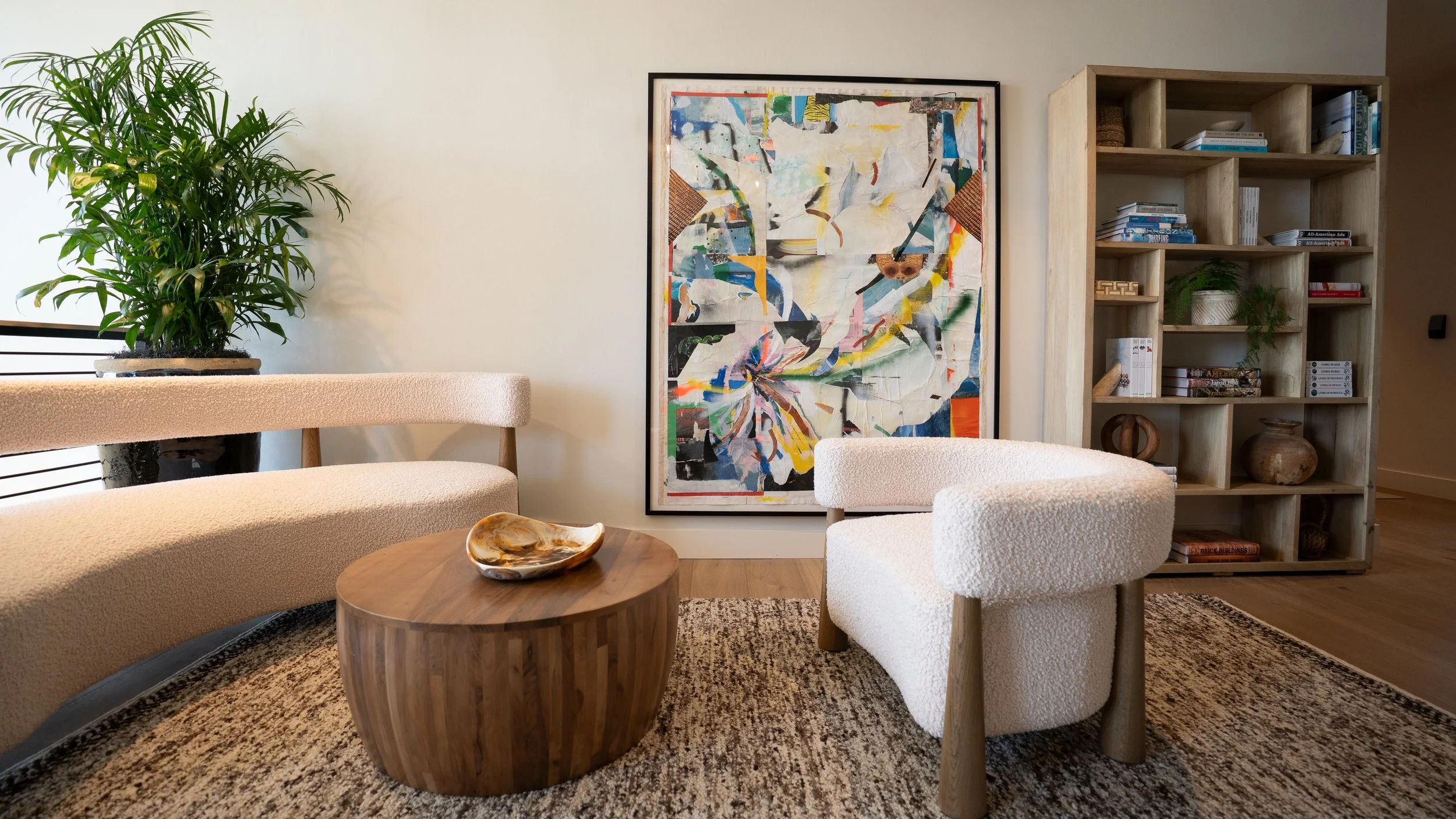 Lounge space at The Sitio, a Virginia Beach boutique hotel with lively wall art and elevated coastal interior design