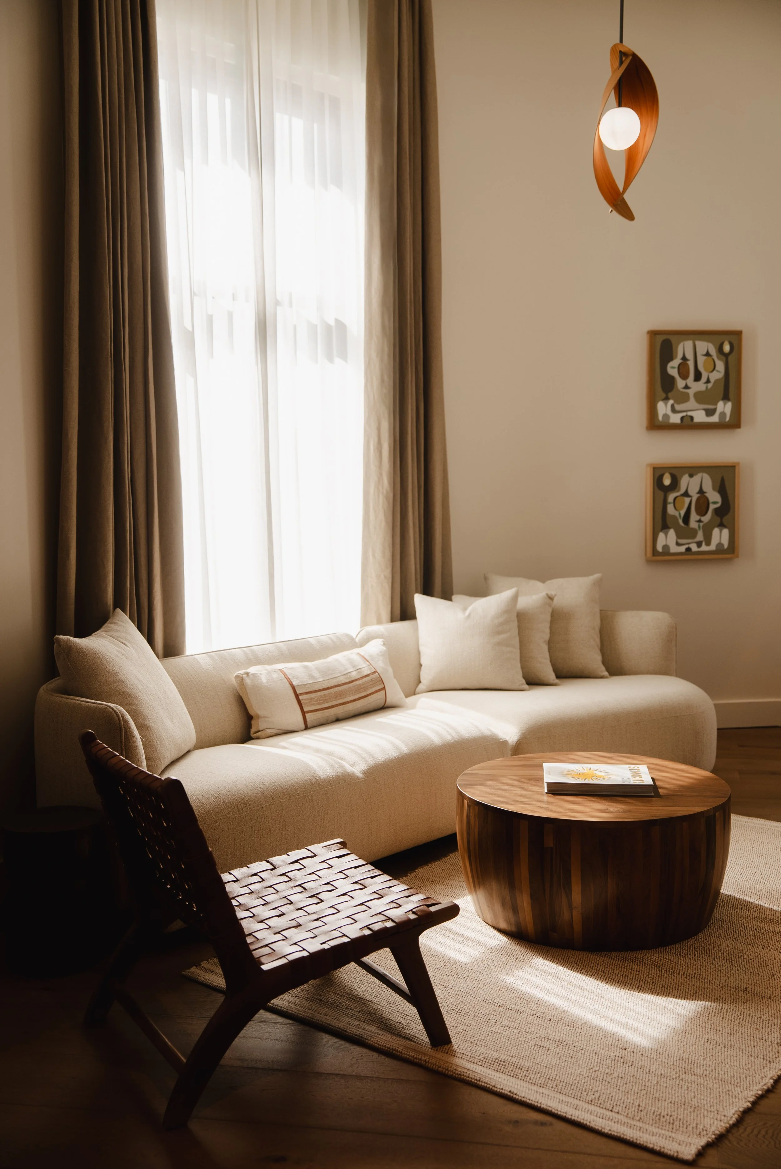 Guest room living area at The Sitio Atlantic Park with relaxed seating and boutique hotel design details