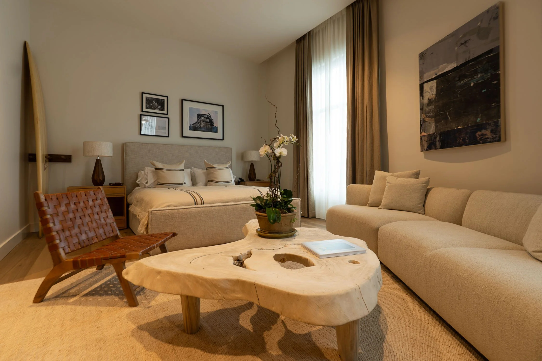 Junior Suite at a boutique hotel in Virginia Beach with Libeco Belgian linens, custom surfboard racks, and coastal interior design