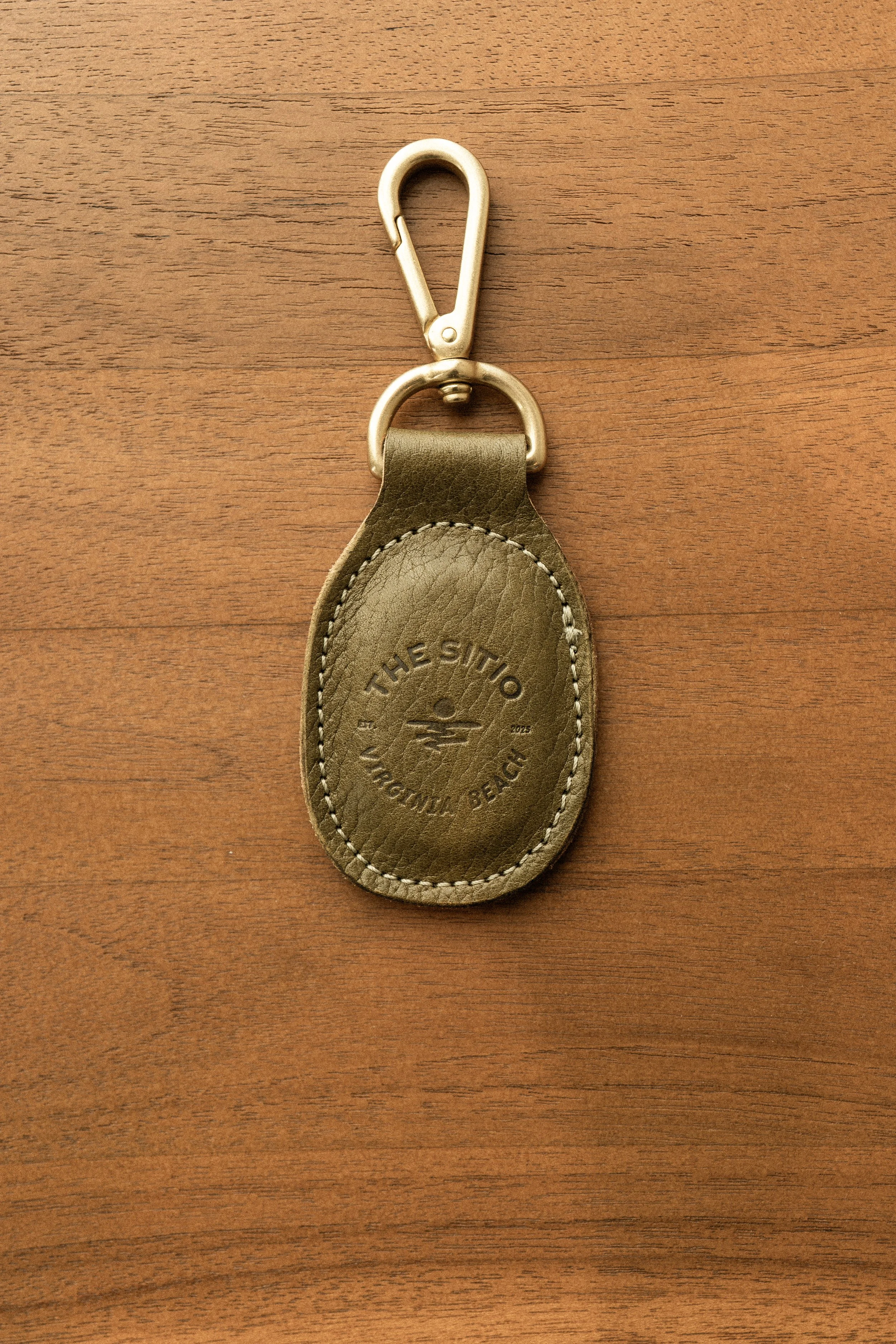 Stamped leather keychain with The Sitio Virginia Beach logo
