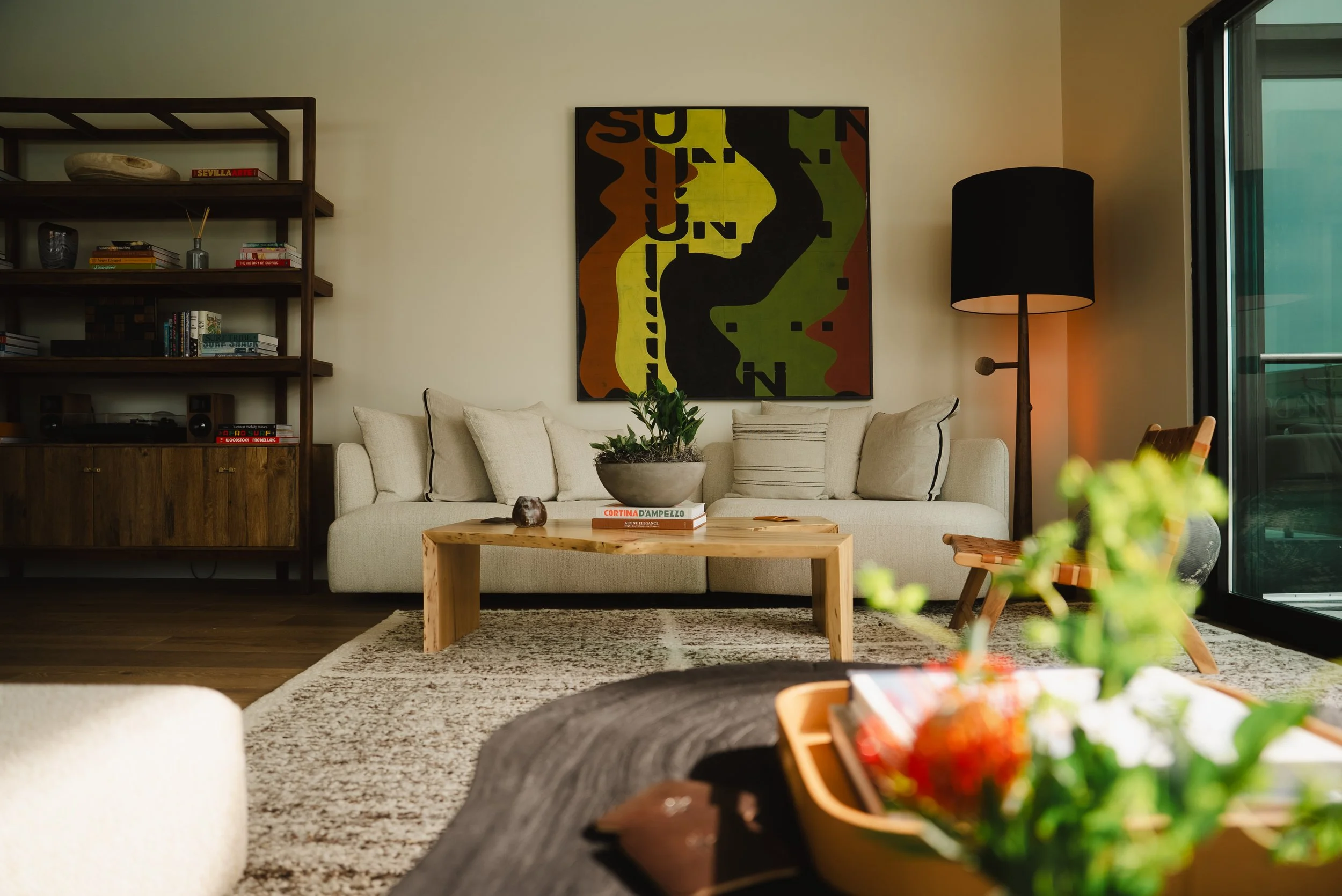 Lounge at The Sitio, a Virginia Beach boutique hotel with modern artwork and elevated coastal furnishings