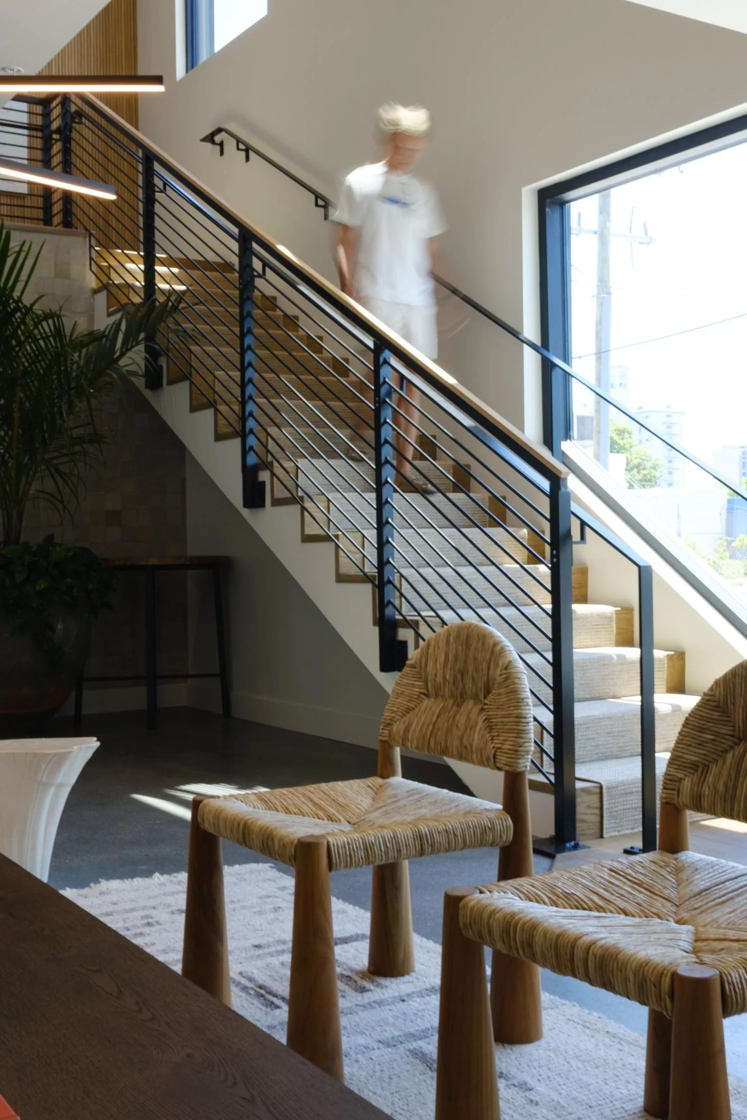 Staircase in the modern lounge at The Sitio with elevated coastal interior design