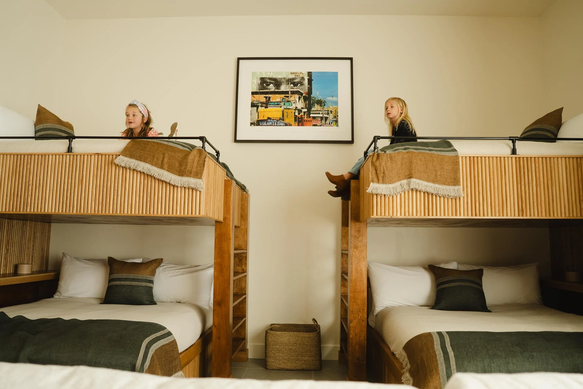 Queen bunk beds in a guest room at The Sitio, a modern hotel room near Atlantic Park