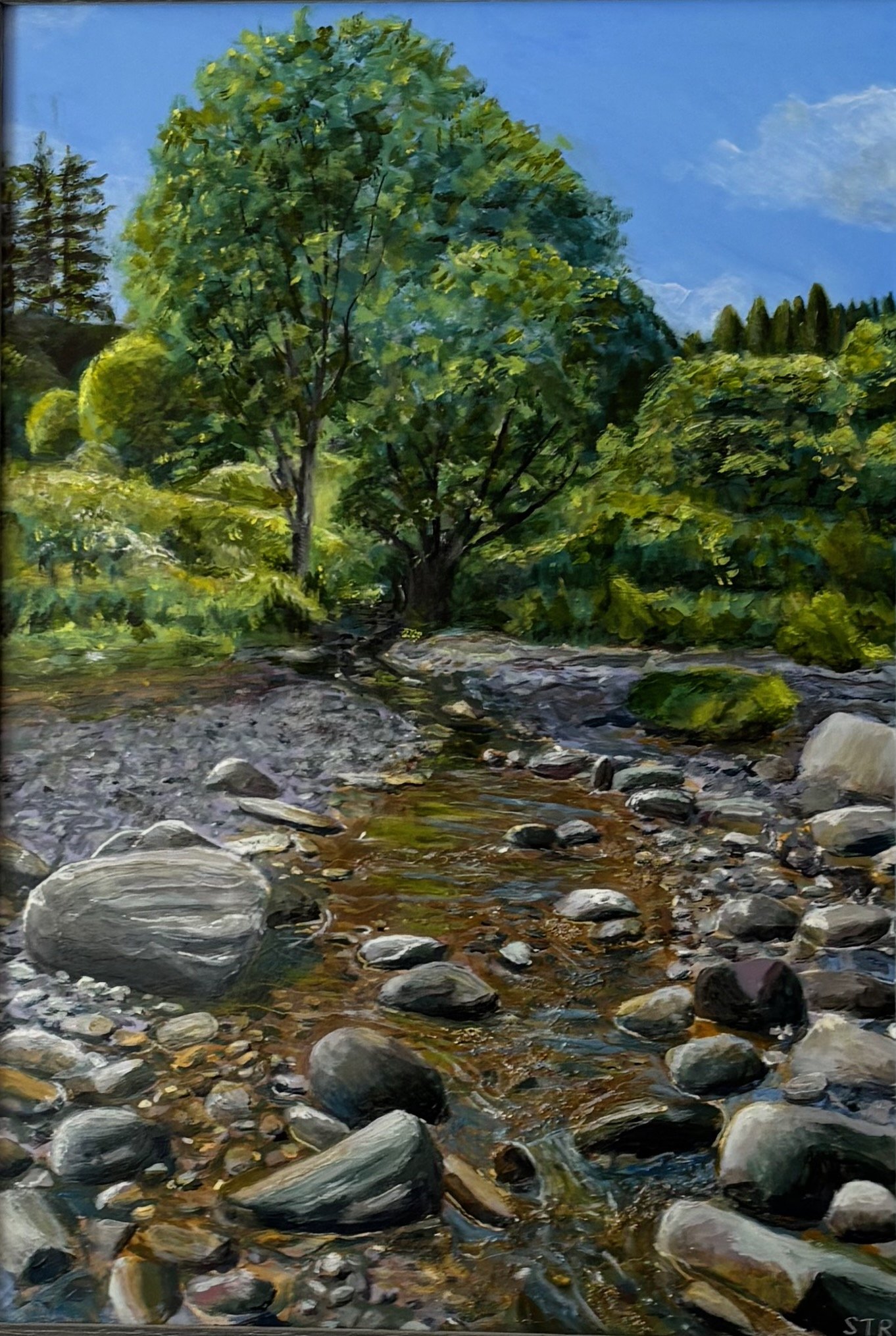 A painting of a natural scene with a stream flowing over rocks and a large leafy green tree in the background under a blue sky.