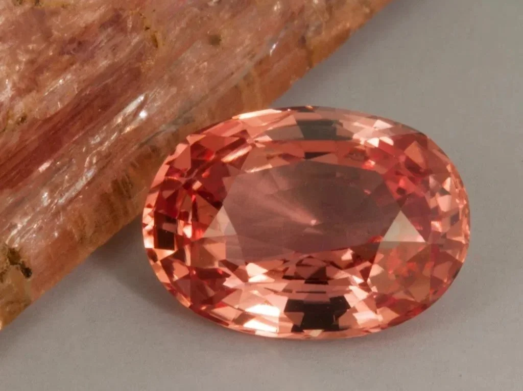 Vivid orange Padparadscha sapphire from Sri Lanka showing strong sunset toned colour.