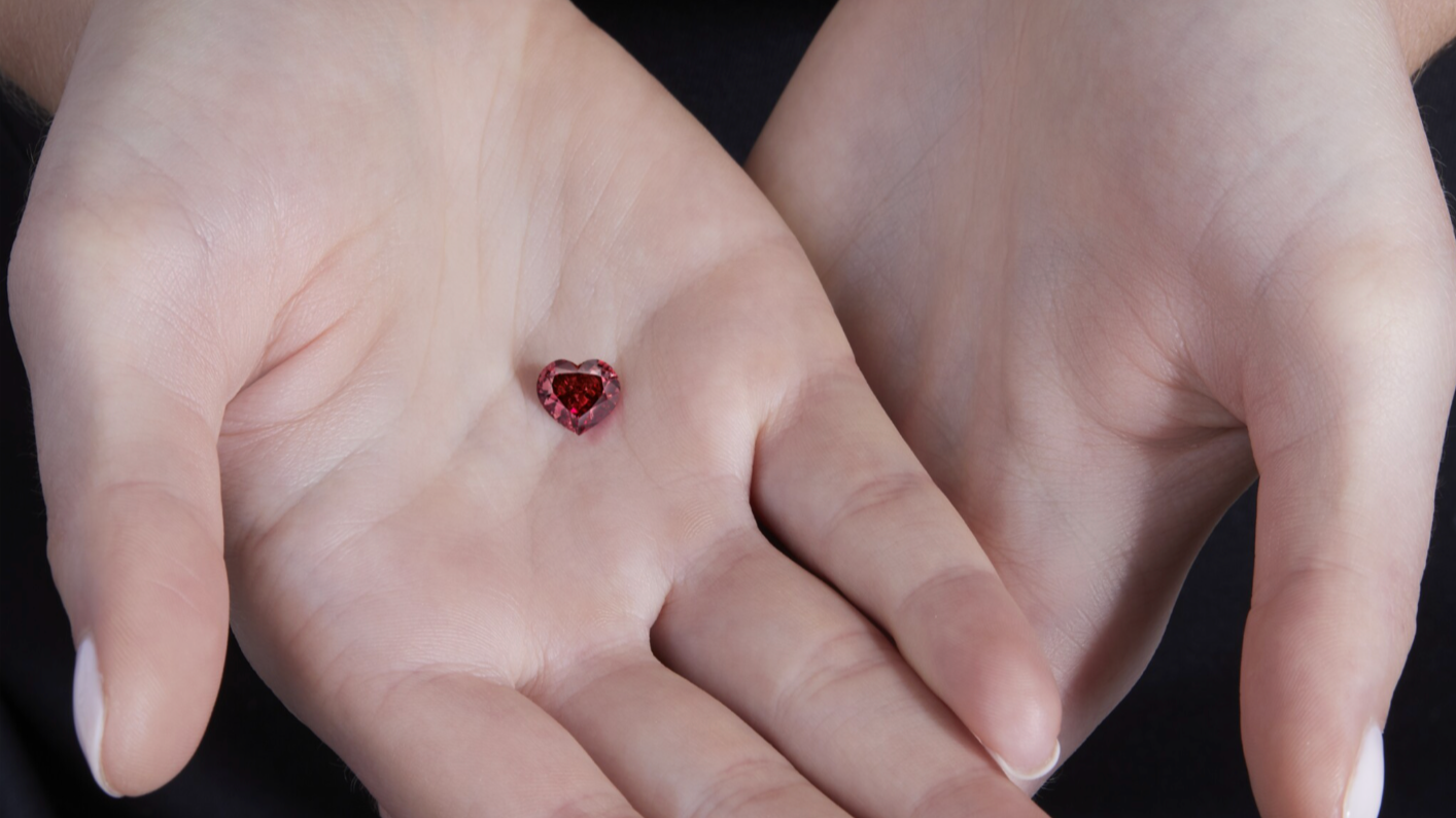 Loose heart shaped natural red diamond presented at a Sotheby’s high jewellery auction.