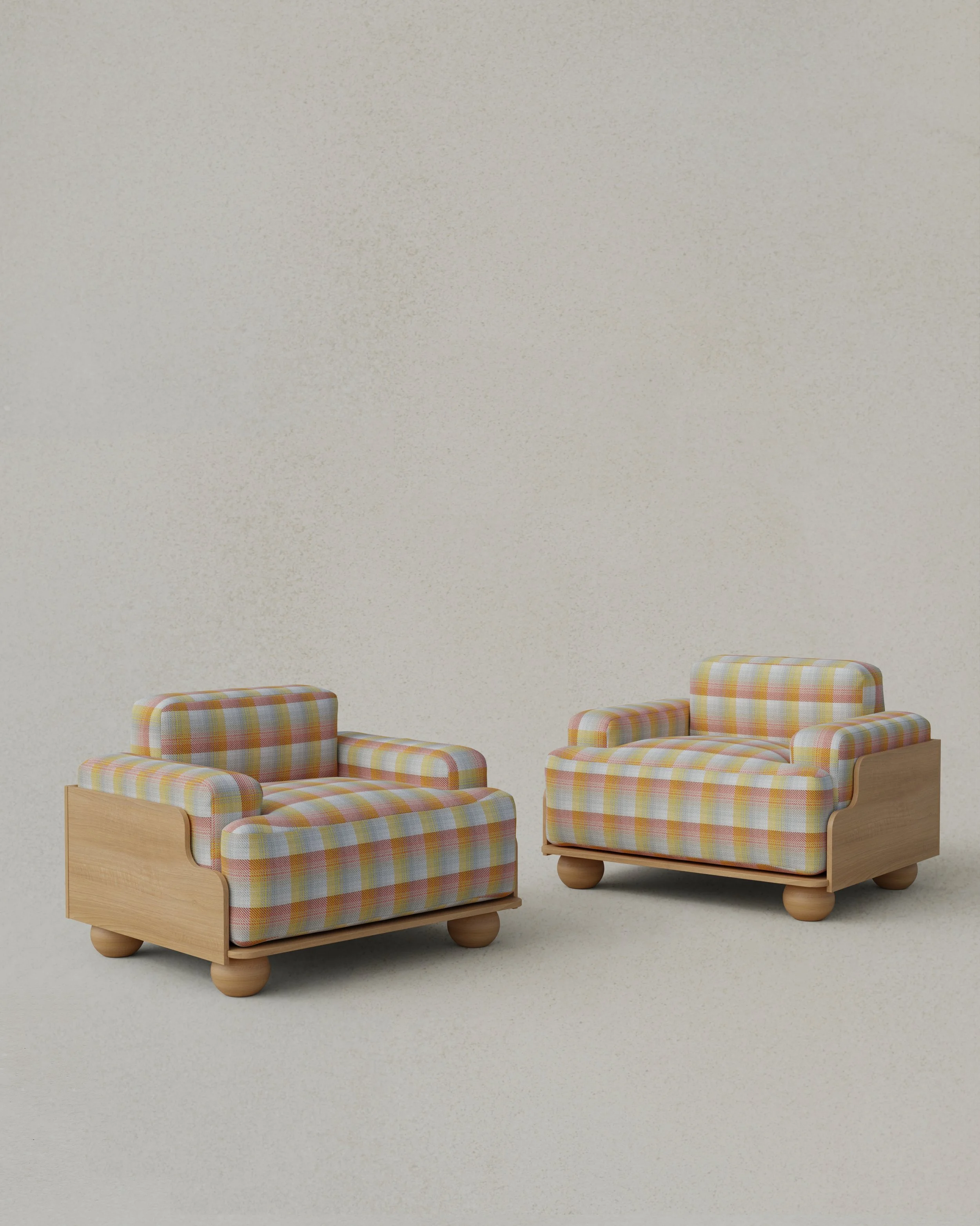 Two small vintage armchairs with plaid fabric cushions and wooden bases on a plain light-colored background.