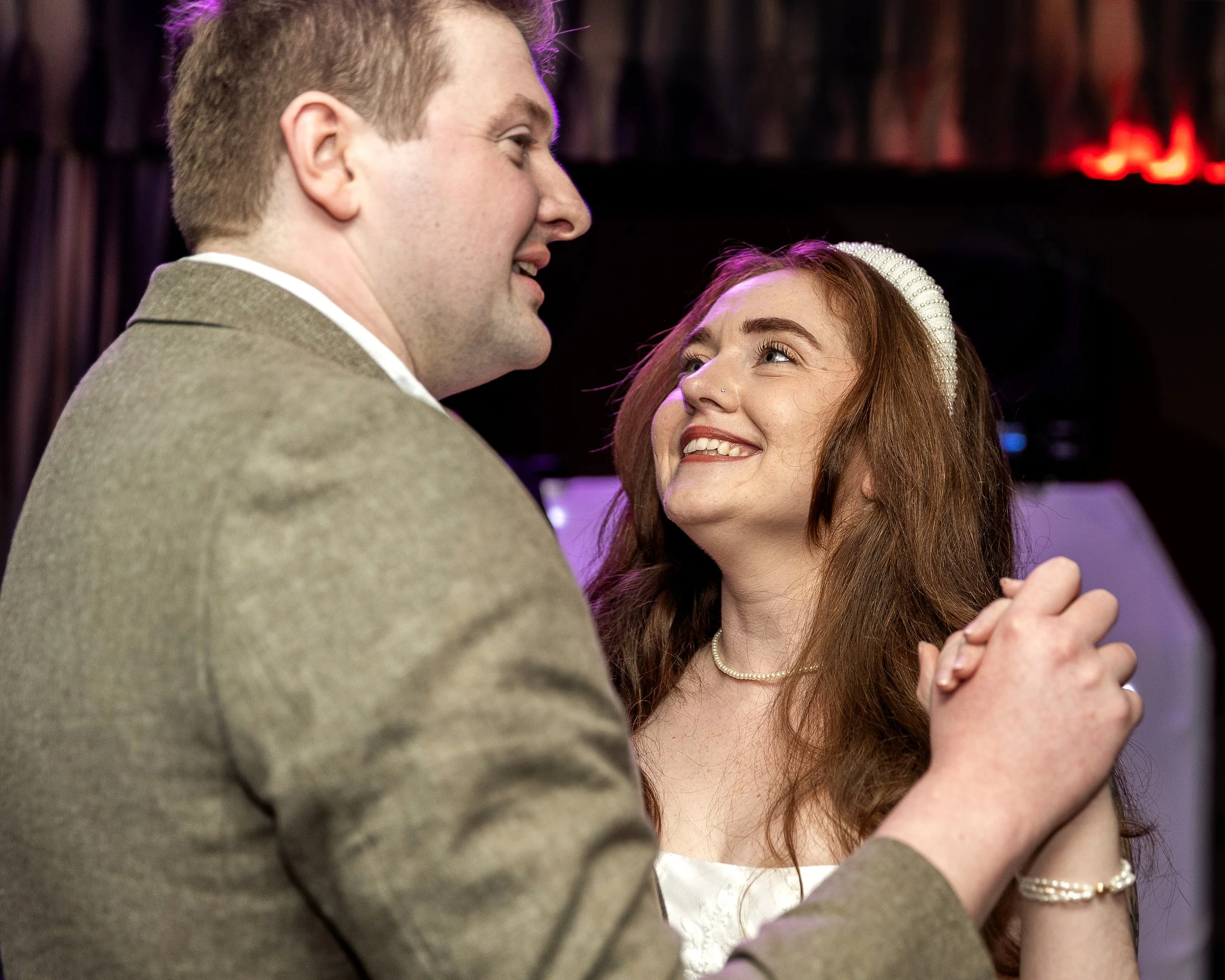 Bride looking up lovingly at her husband at their Hertfordshire wedding 