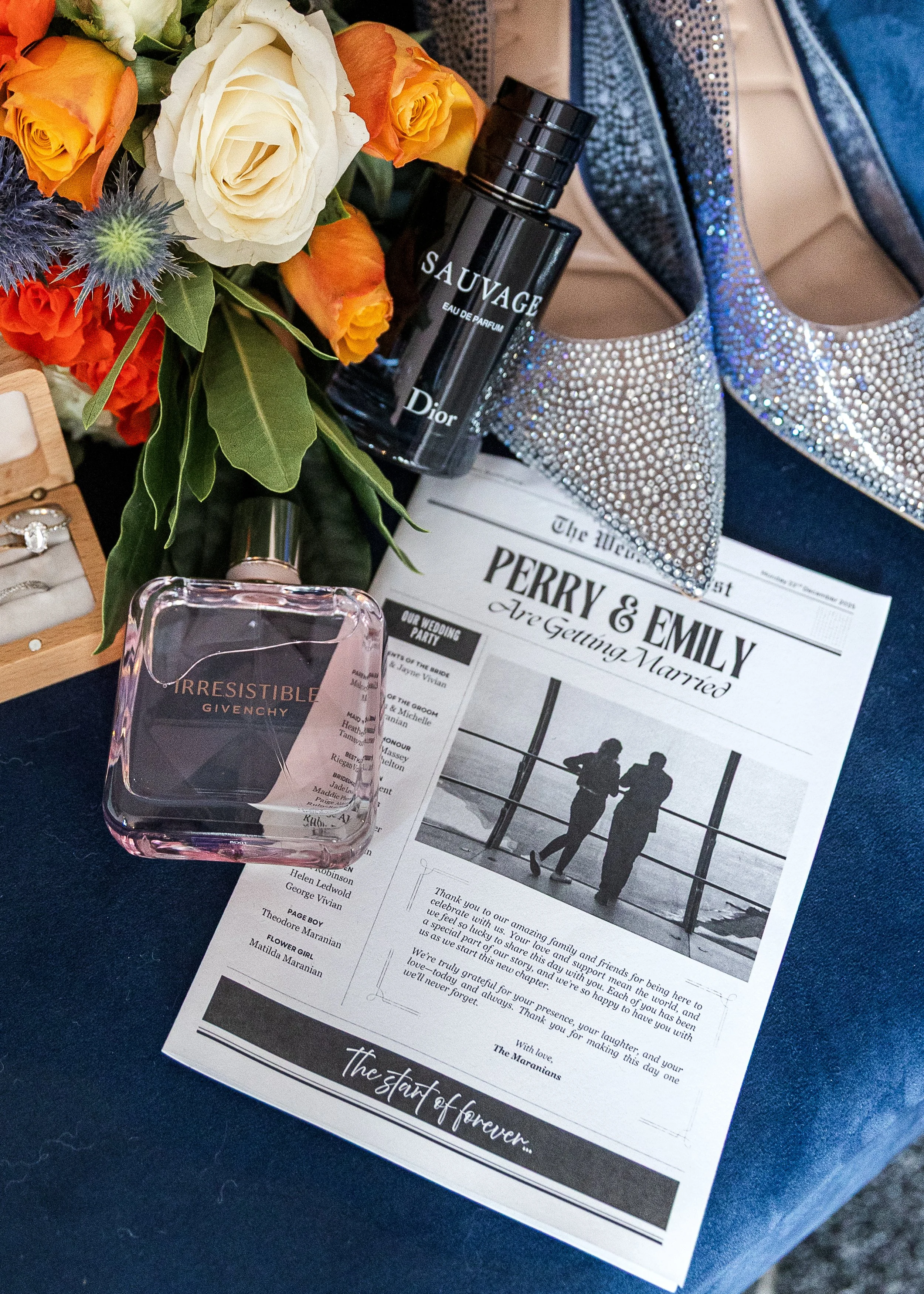 Wedding "flat lay" of perfume, wedding rings, bouquet and order of service taken at a Hertfordshire wedding 