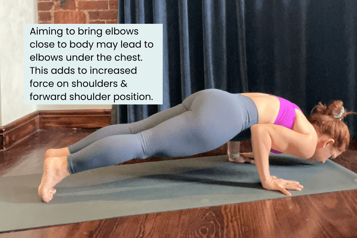 Dr. Trish Corley in chaturanga with elbows tucked too far under the body showing increased load on the shoulder