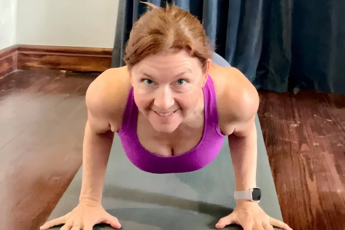 Dr. Trish Corley demonstrating rotator cuff stability in chaturanga, a weight bearing yoga postu