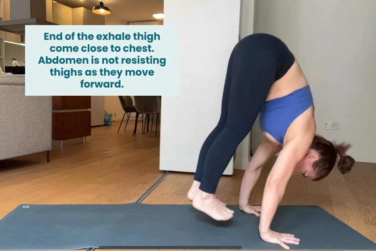 Trish Corley at the end of the exhale floating forward in yoga, thighs close to chest with abdomen not resisting movement