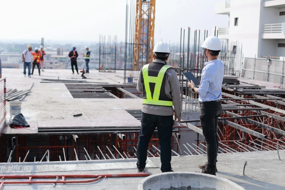 Construction team at work, representing the building phase of the yoga injury proliferation phase