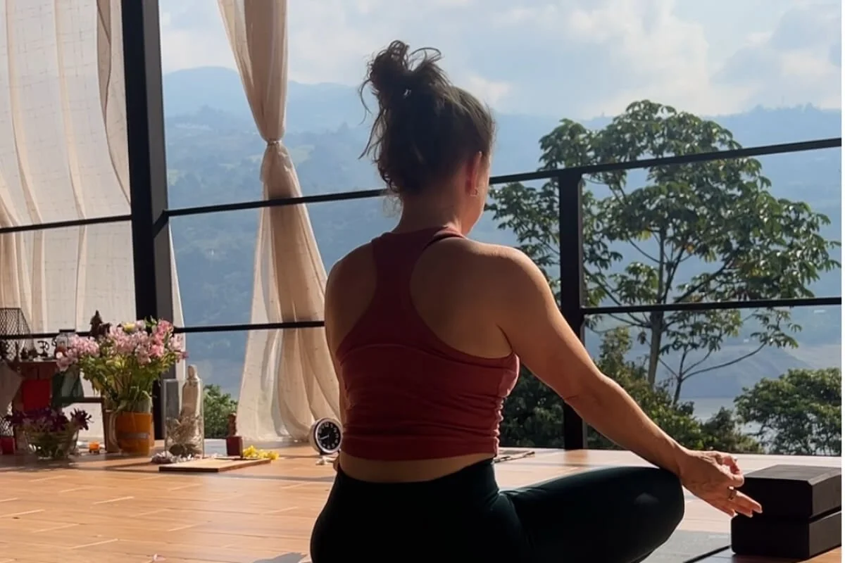Yoga teacher in seated practice, representing the yoga injury remodeling phase of healing