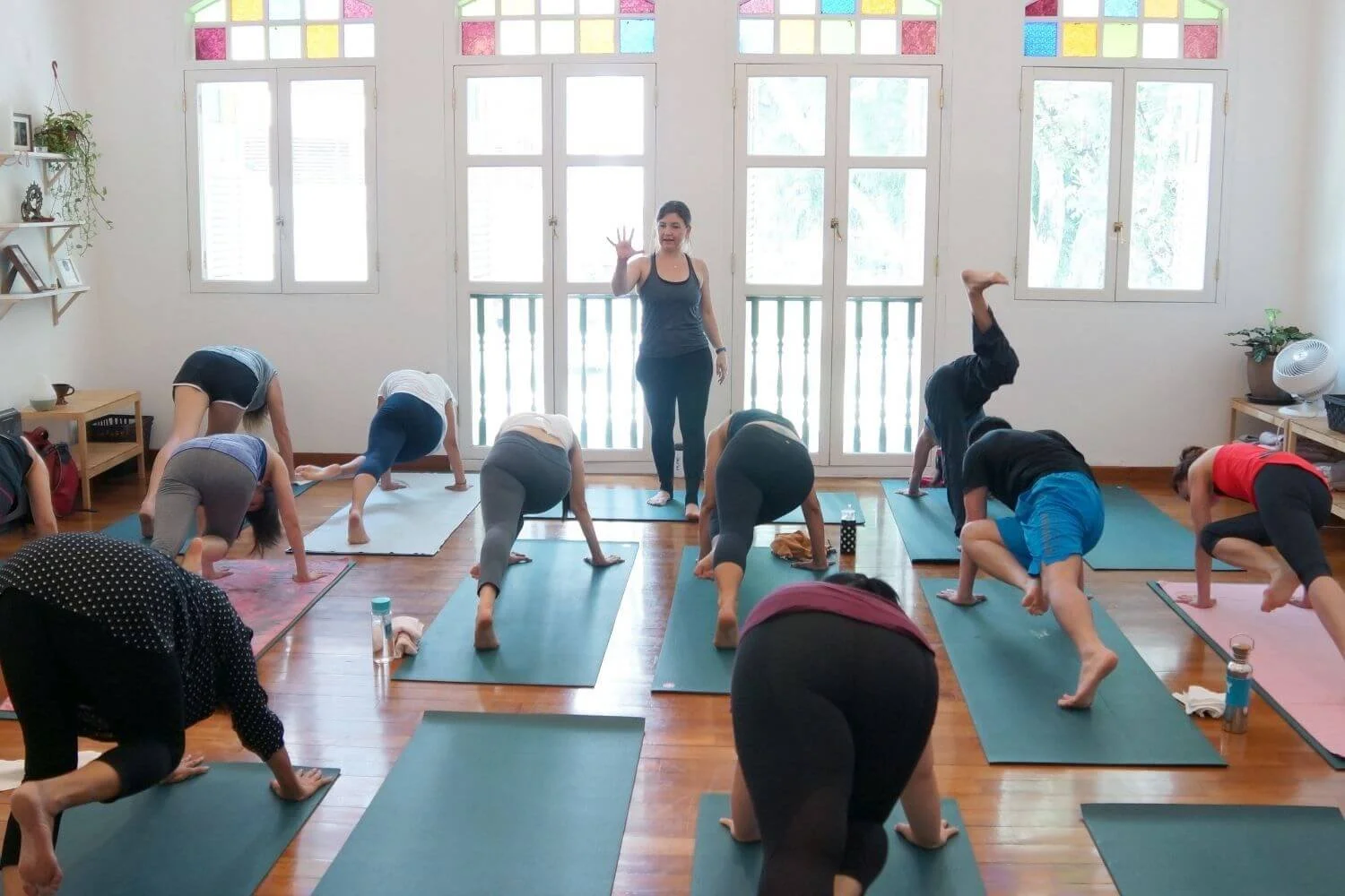 Dr. Trish Corley leading a yoga teacher training session in Lisbon Portugal