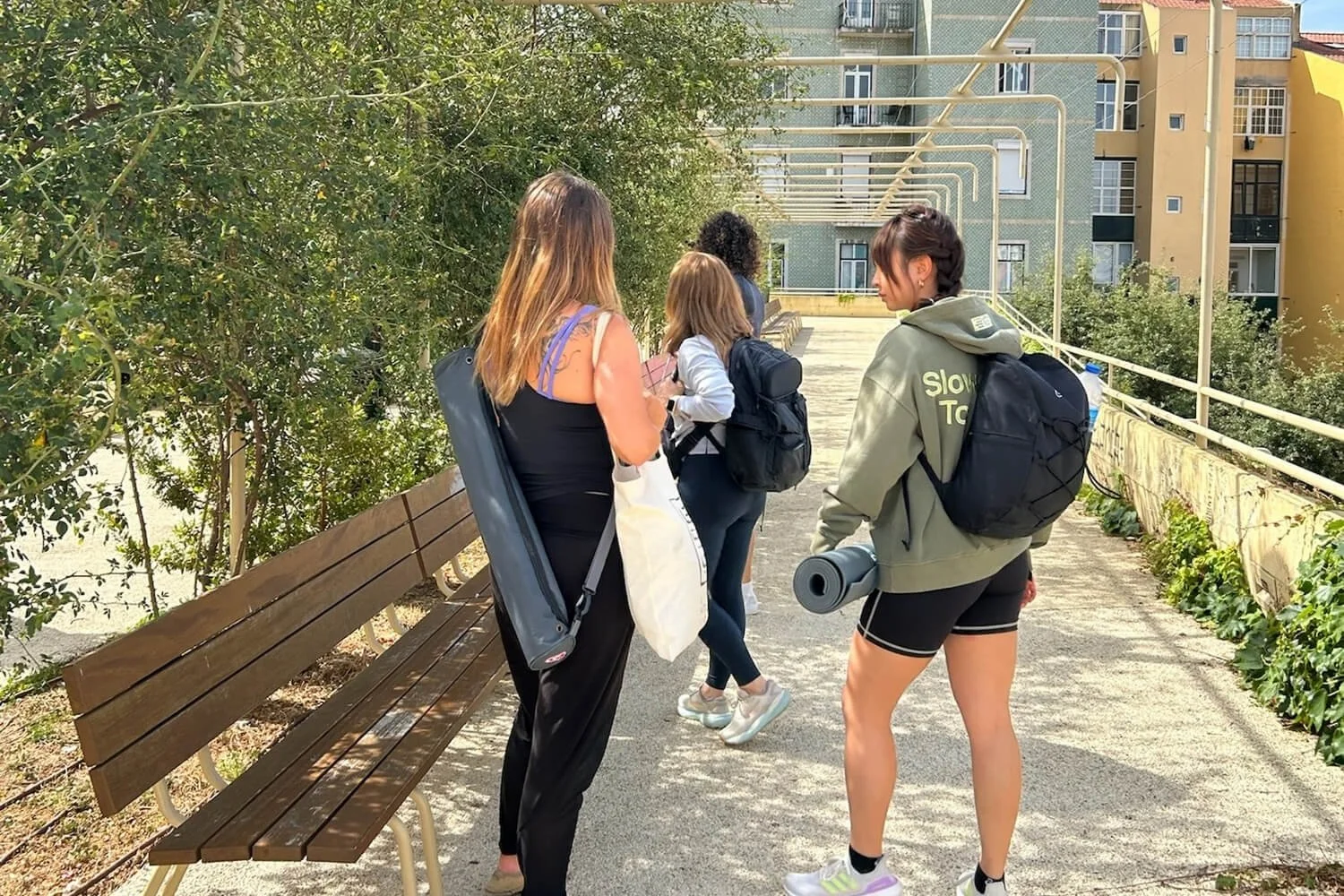 Yoga teacher training participants walking through a neighborhood in the Lisbon area of Portugal