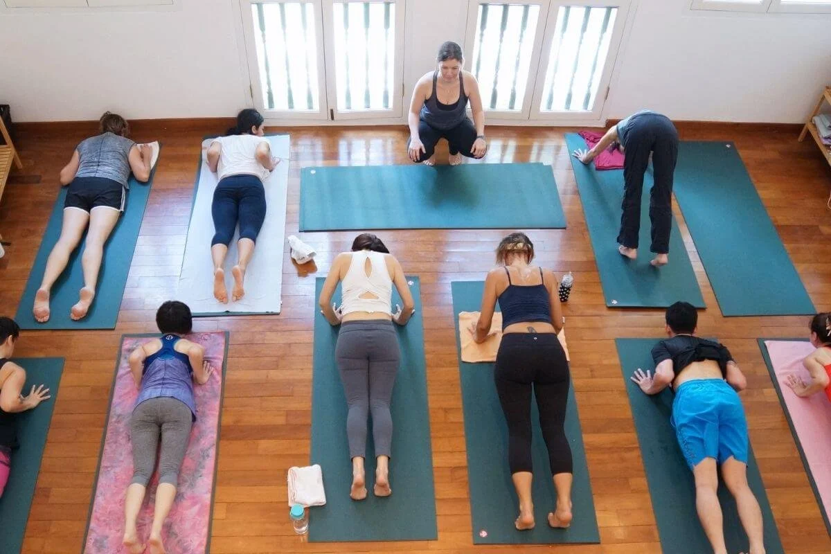 Trainees practicing together during a yoga teacher training in Europe with Power to Lead in Lisbon, Portugal