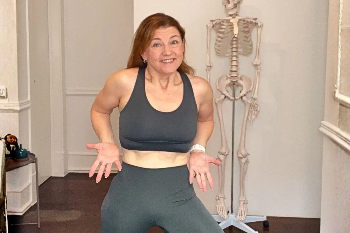 trish corley yoga teacher demonstrating over engagement of the core