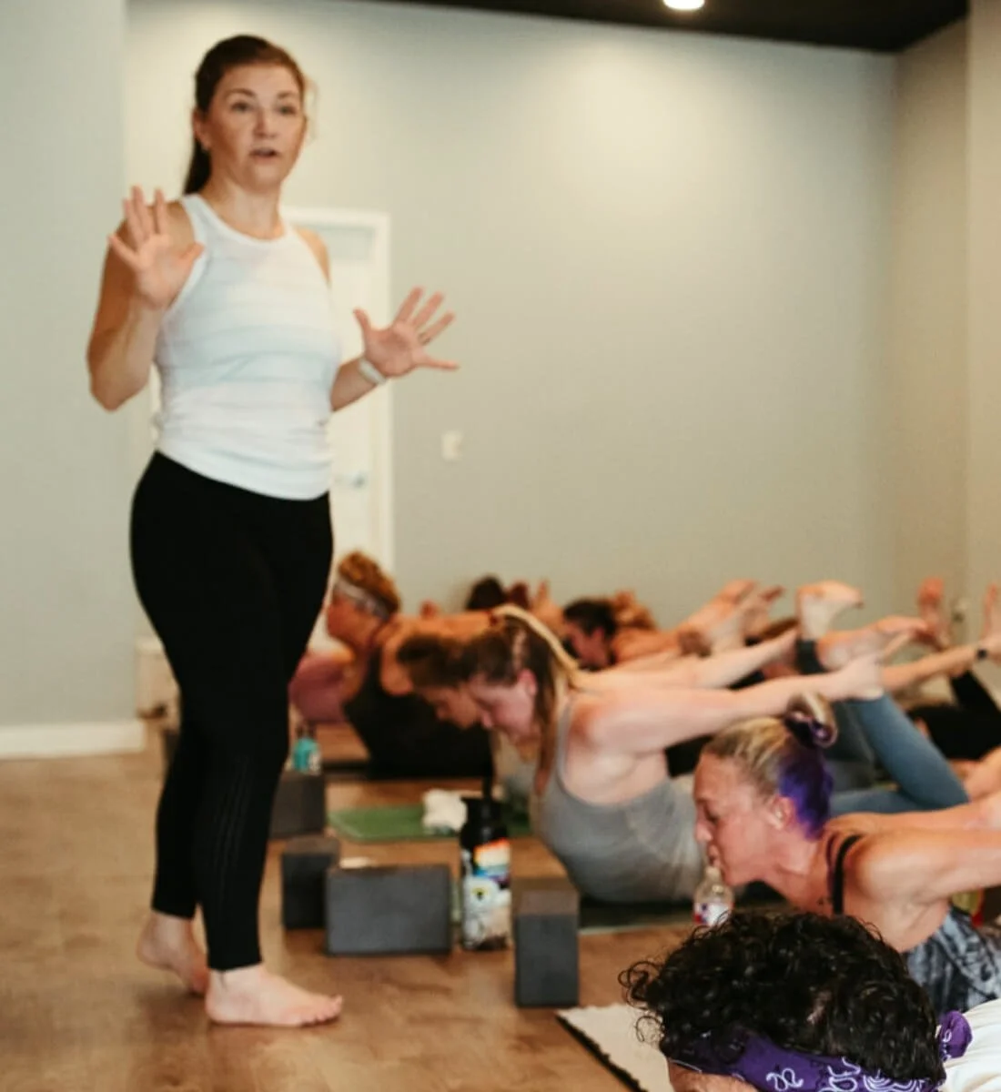 dr trish corley demonstrating clear cueing technique to students during class