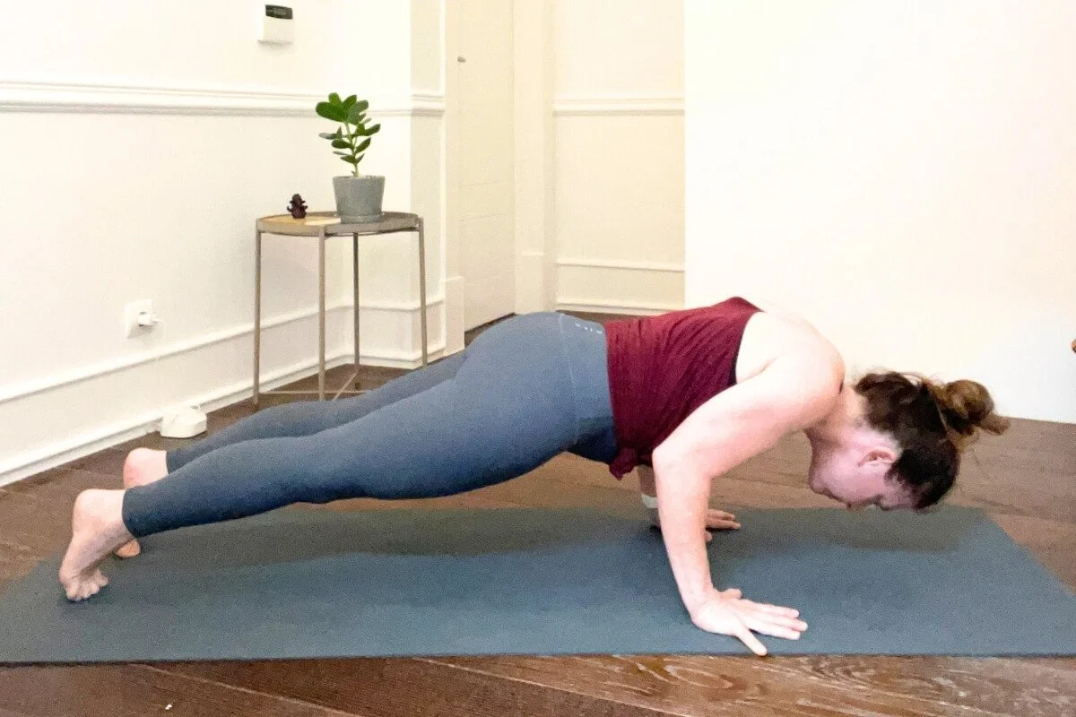 Common Chaturanga misalignment with head dropped below the shoulders