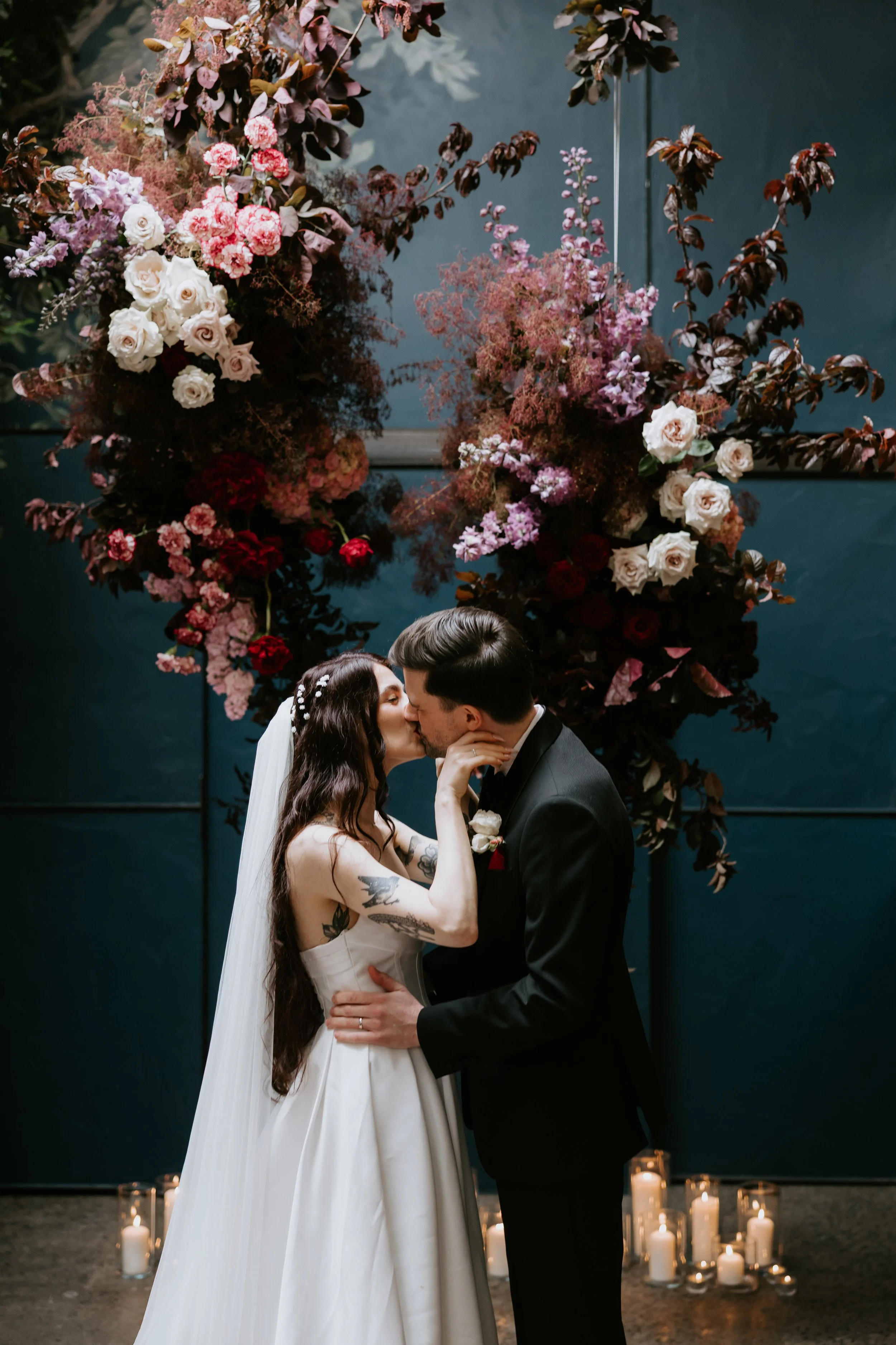 Maddy and Tom share their first kiss at their Rupert on Rupert wedding in Collingwood.