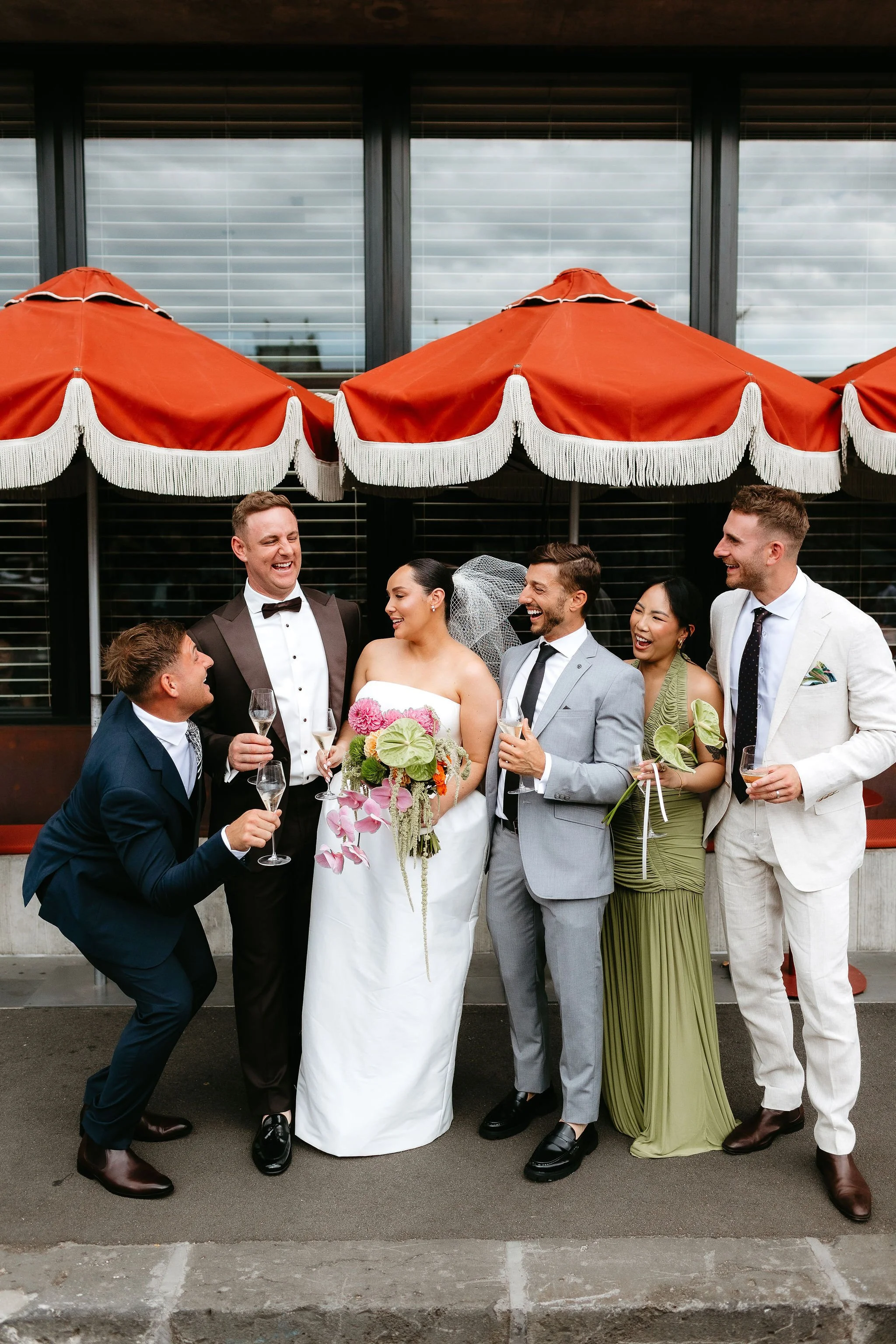 Erin and Matt celebrate their wedding with their wedding crew.