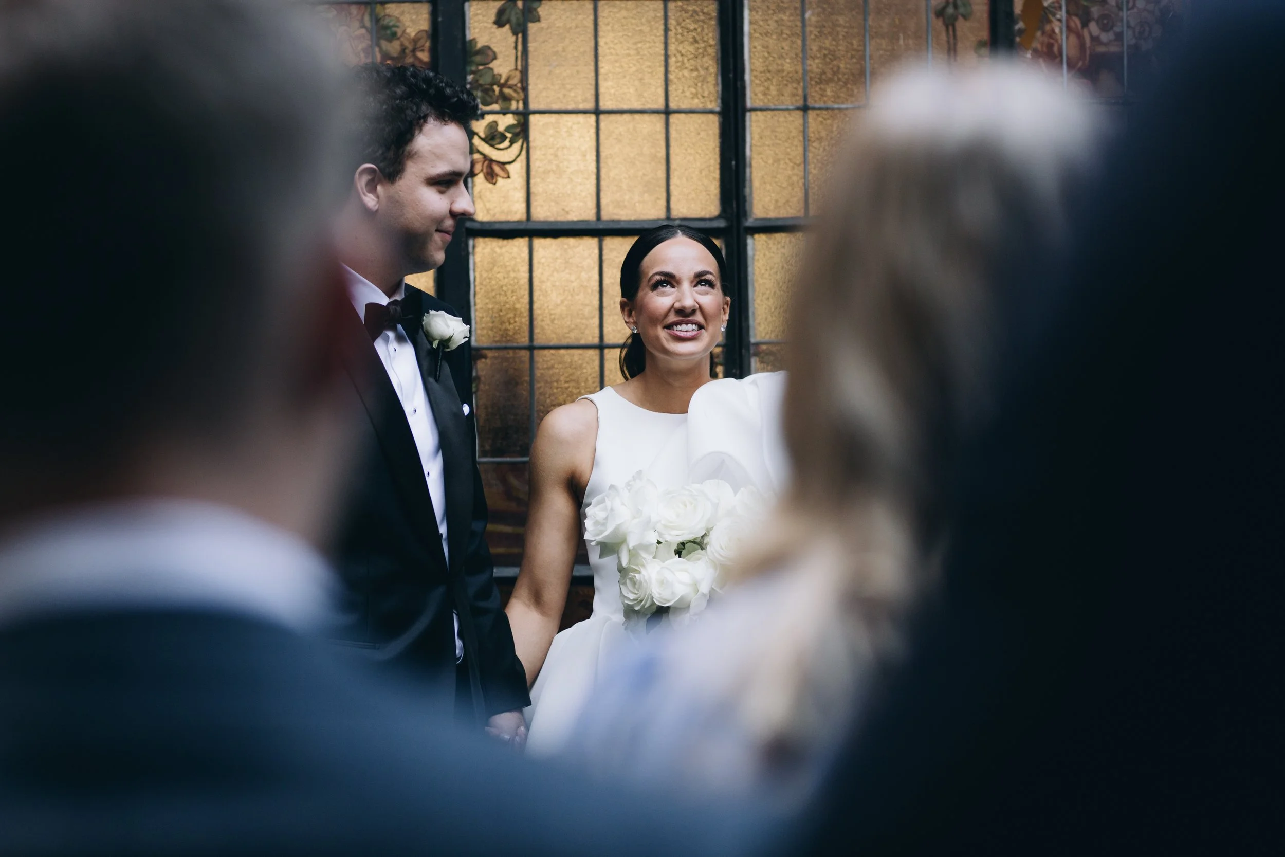 Shenay looking to the sky during wedding ceremony at Recoleta in Melbourne