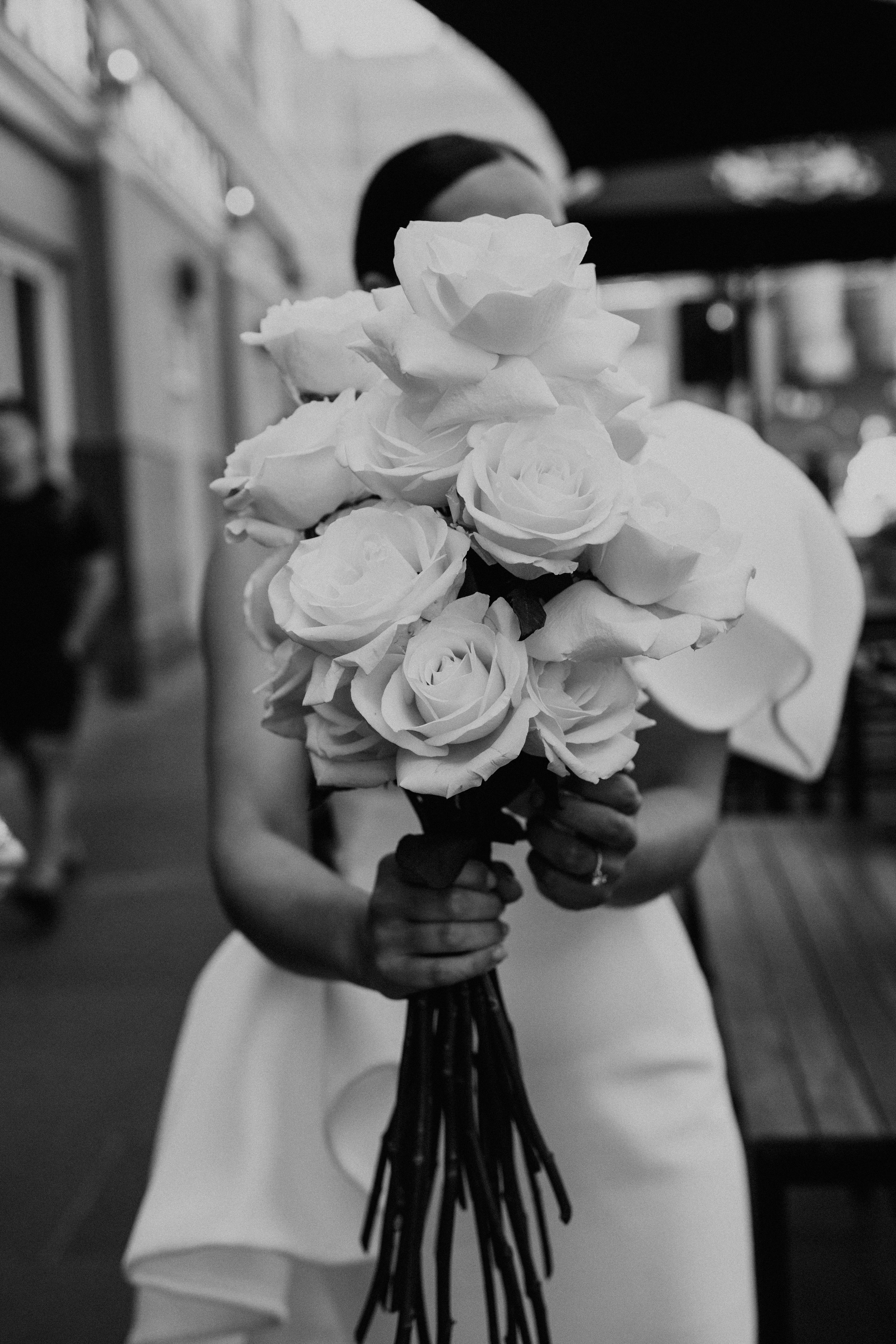 Bride holds her bouquet of white roses before her wedding at Recoleta in Melbourne