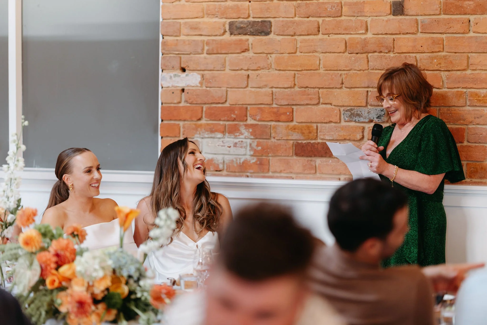 soph-meg-the-farm-yarra-valley-wedding-reception-smiles.jpg