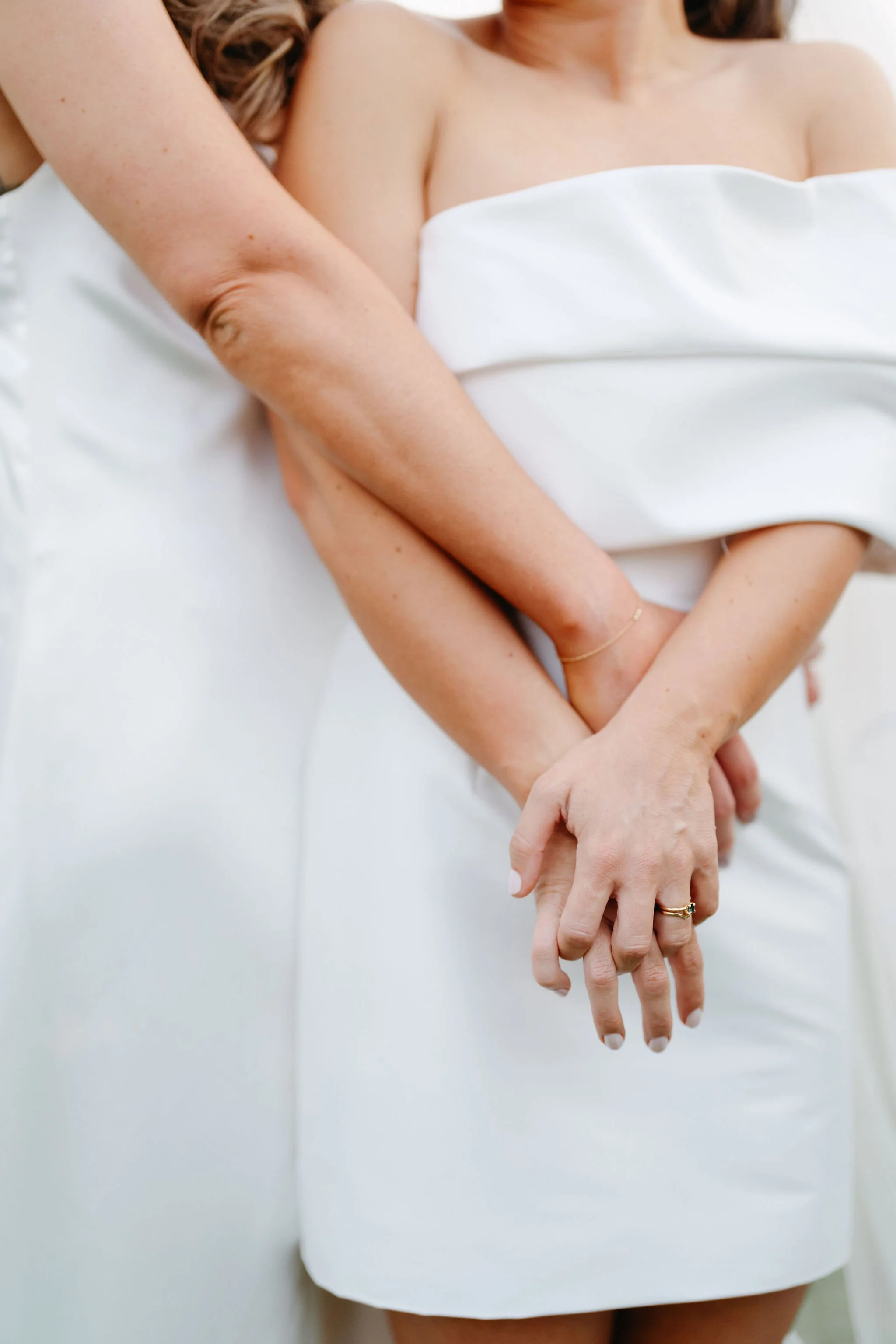 soph-meg-the-farm-yarra-valley-wedding-two-brides-holding-hands.jpg