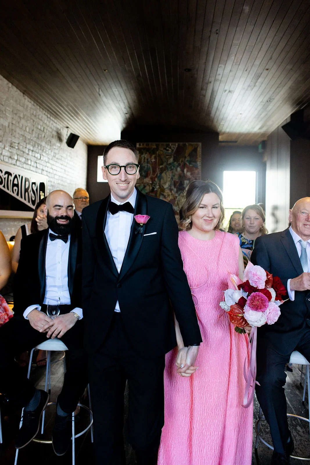 ally-simon-poodle-wedding-melbourne-pink-wedding-dress-aisle-walk.jpg
