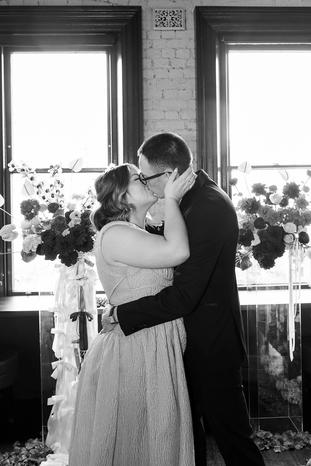 ally-simon-poodle-wedding-melbourne-black-and-white-first-kiss.jpg