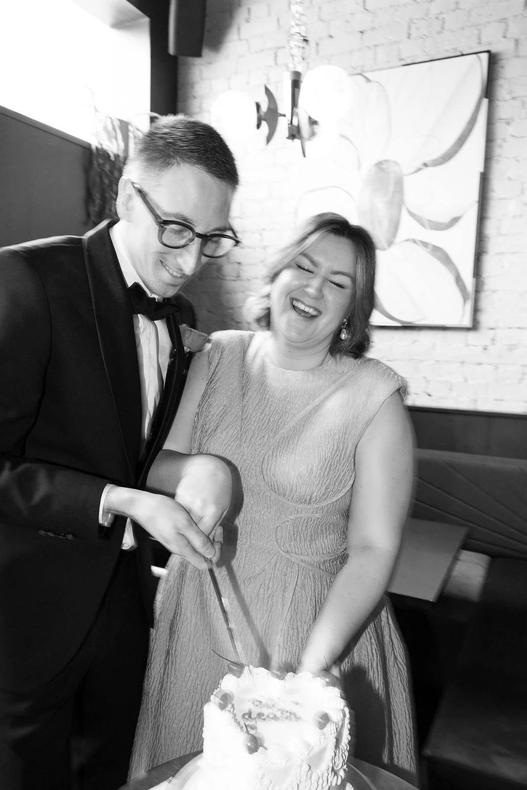ally-simon-poodle-wedding-melbourne-black-and-white-cake-cut.jpg