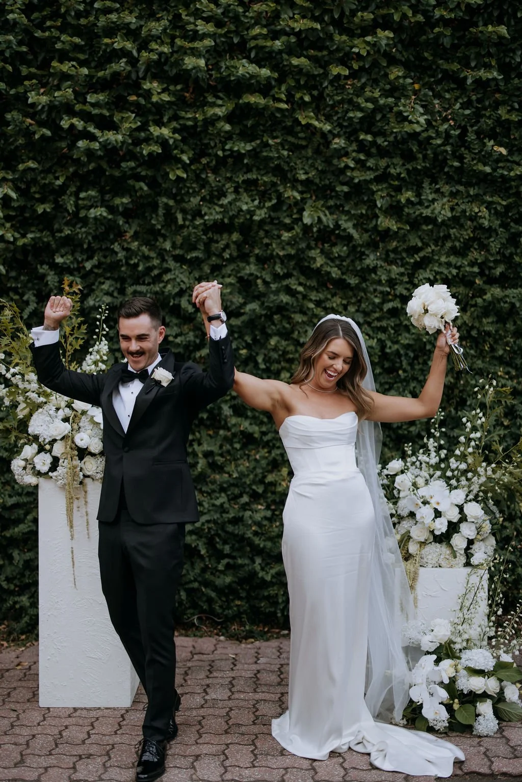 Bride and Groom celebrate at Butler Lane, Melbourne during their wedding