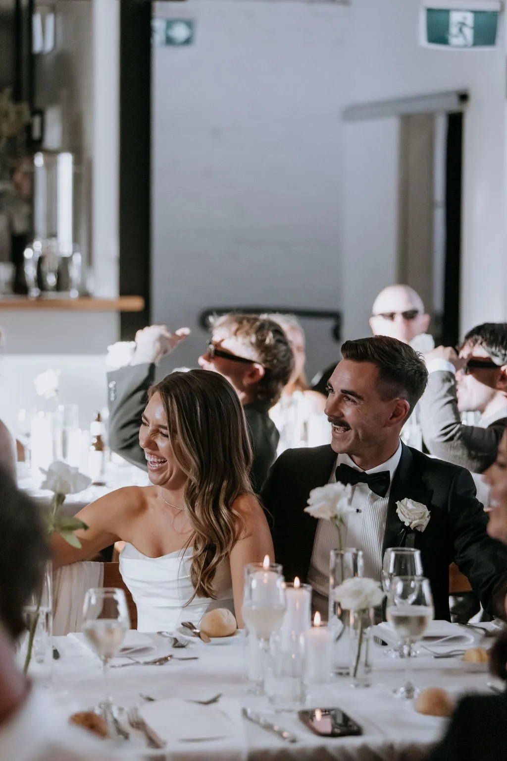 Guests laughing during wedding speeches at Butler Lane, Melbourne